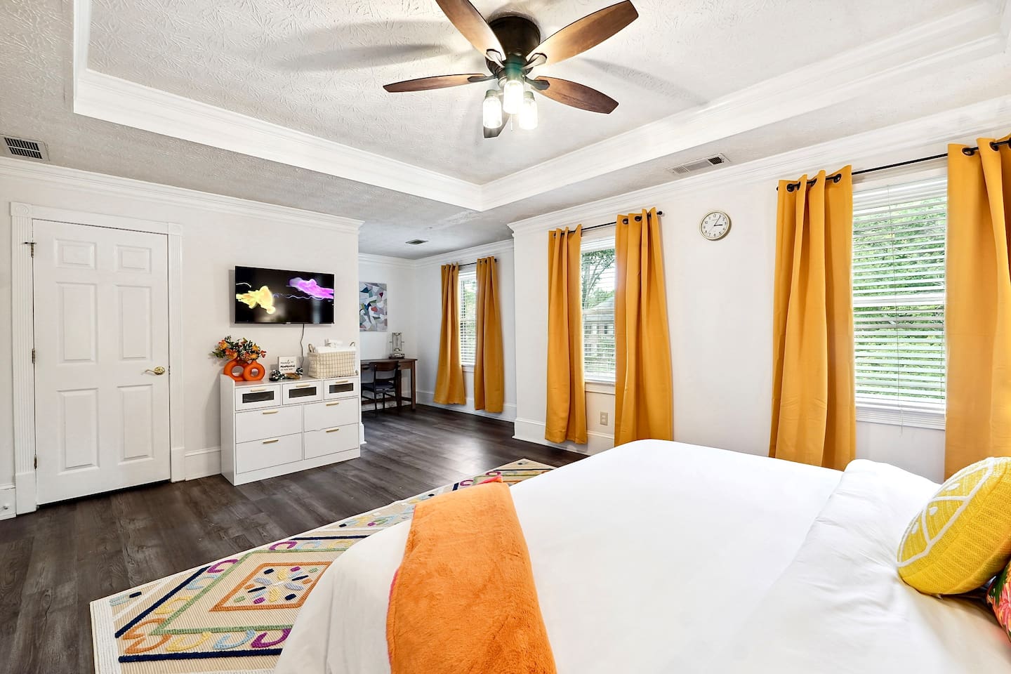 Bedroom 3 is located upstairs, a master bedroom featuring a king bed, TV, a private en-suite bathroom, and a dedicated desk space.