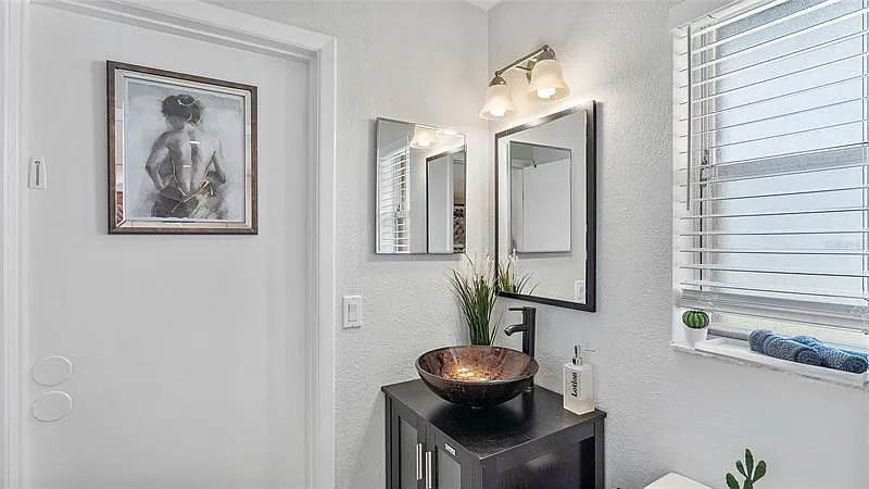 The guest bathroom has a standing shower (no tub).
