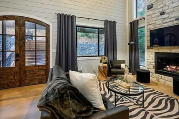 Cozy living space with fireplace and stylish seating for relaxing evenings.