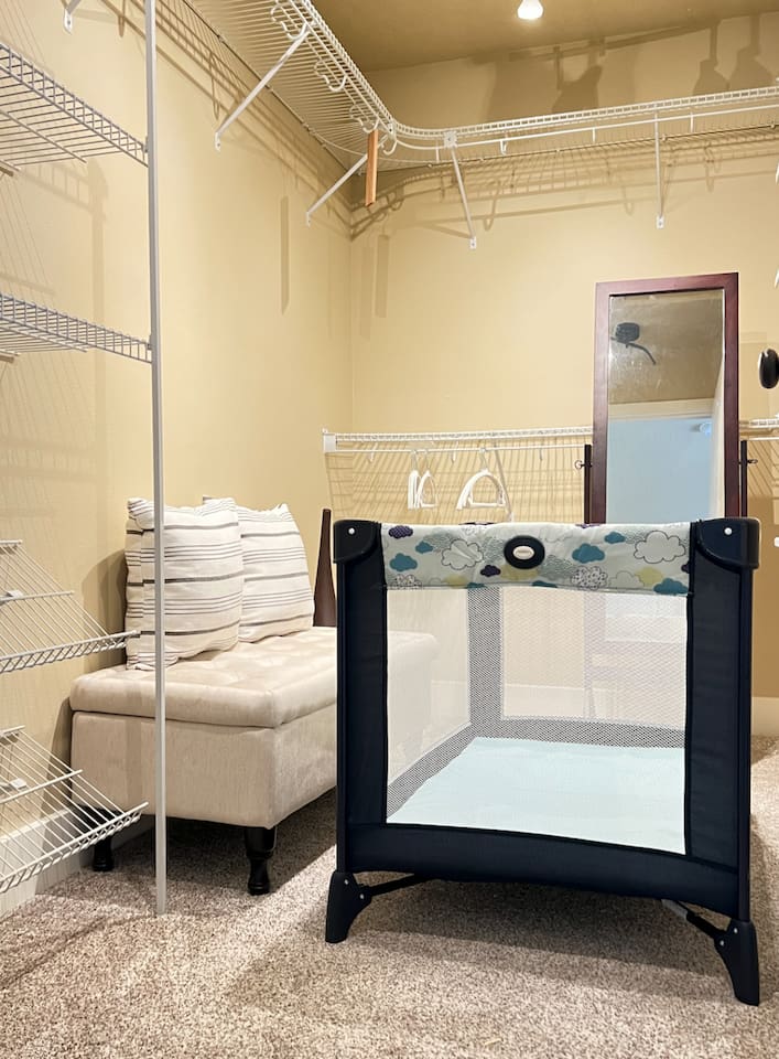 This is the master bedroom closet, we store the travel bassinet here. 