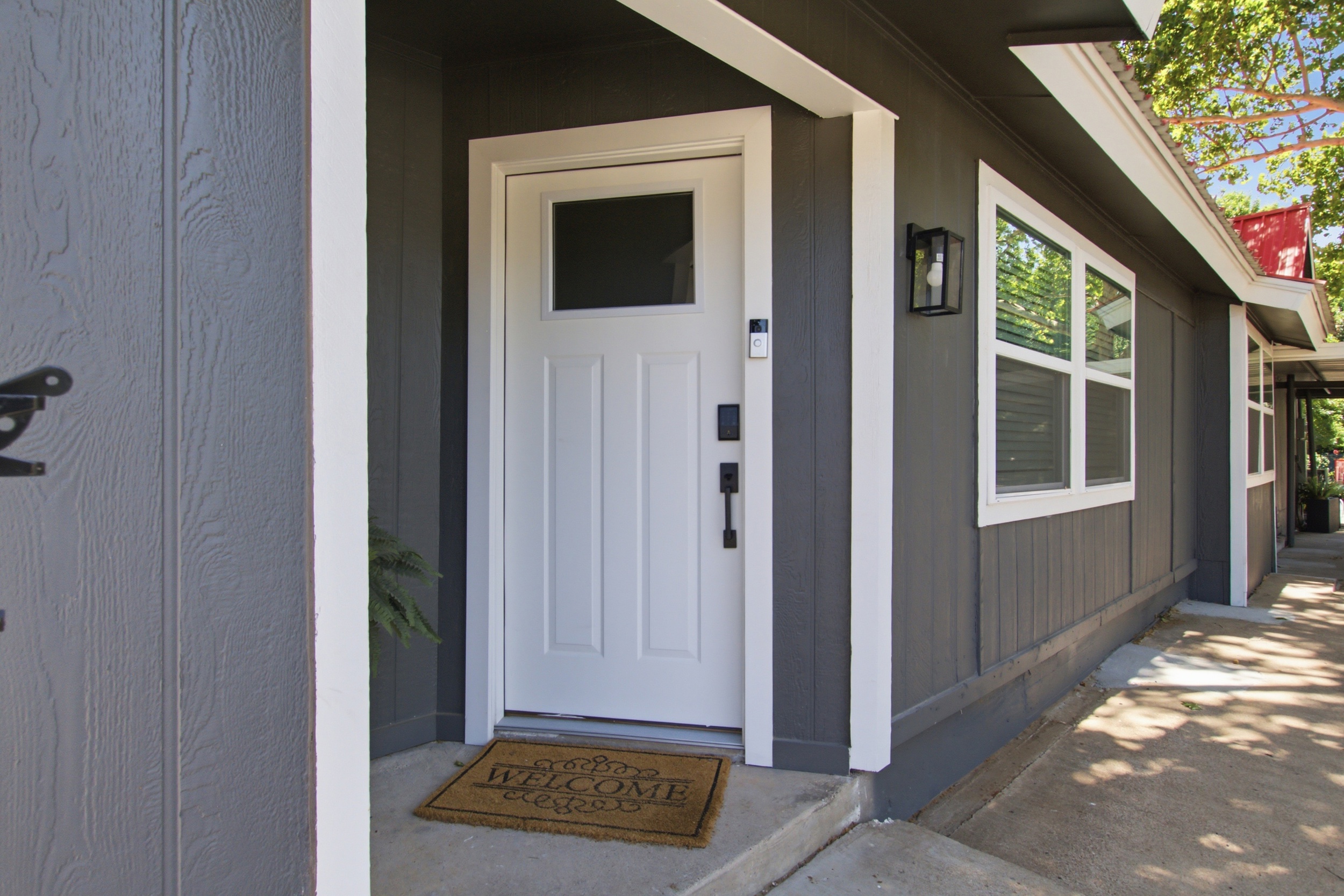 Step into comfort with a charming porch and inviting door!