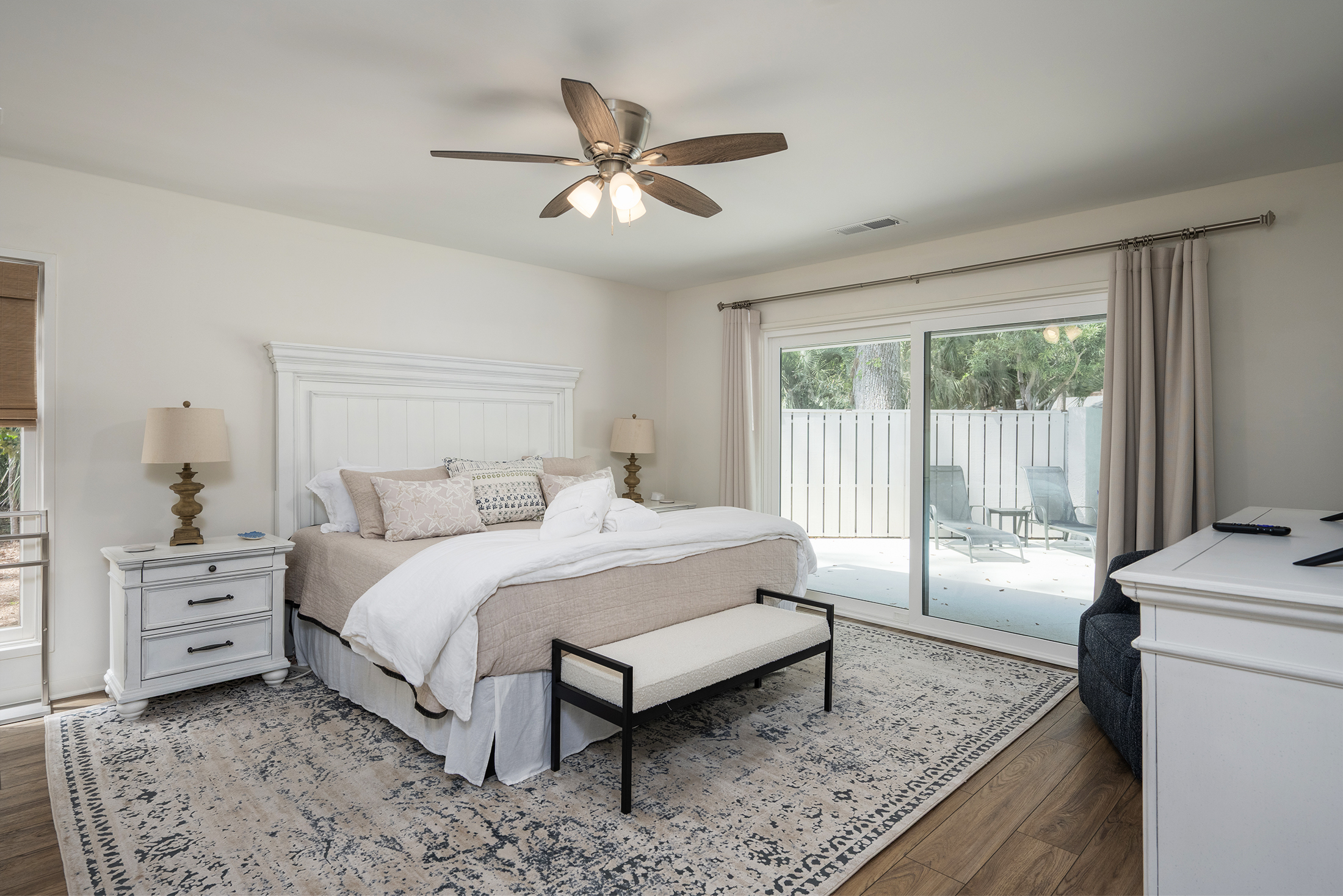 Primary BR features a King bed and new sliding glass door allows wasy access to the pool