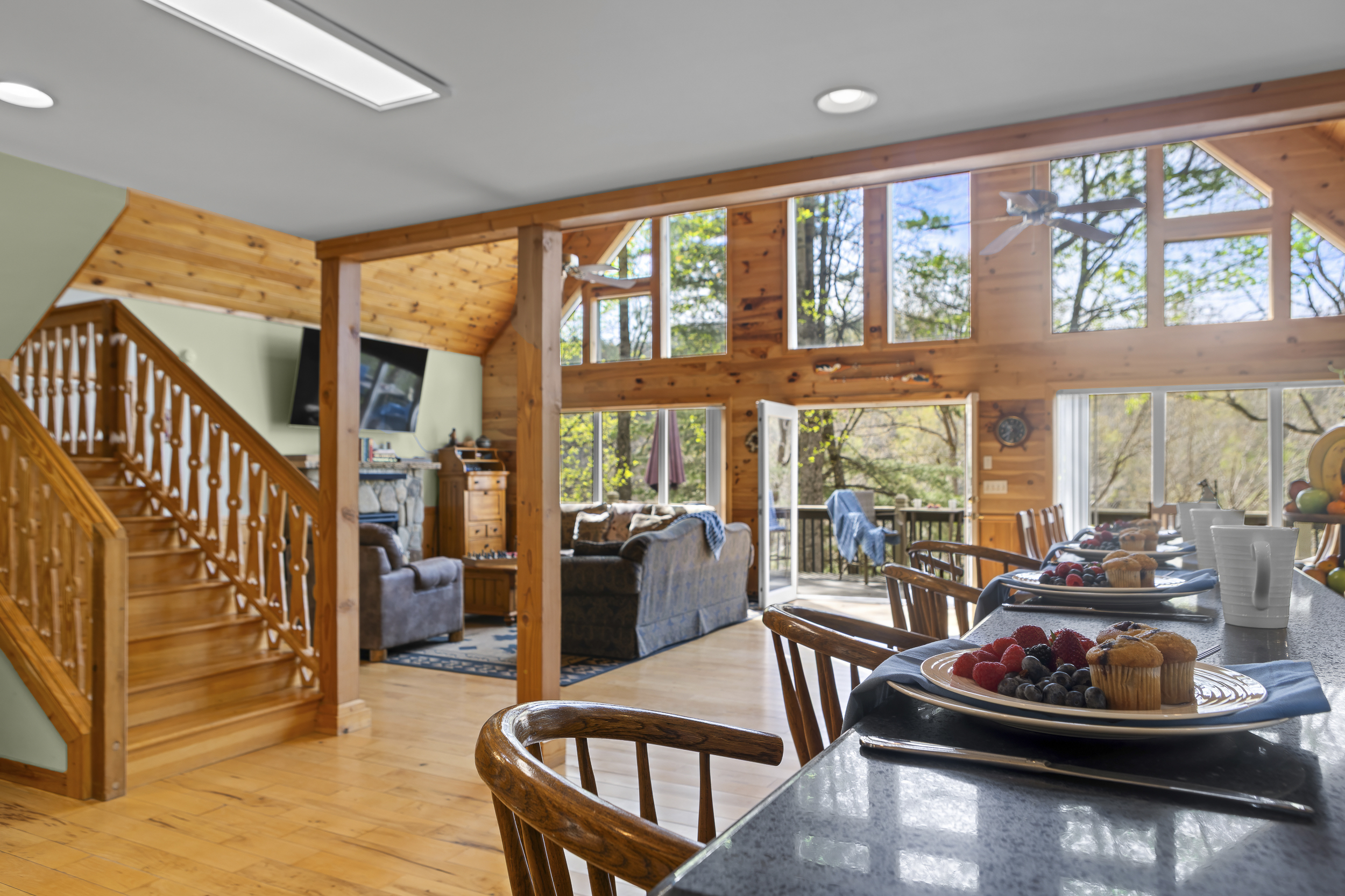 Dining & Living Area: Bright space with wooden details and stunning views for unforgettable gatherings!