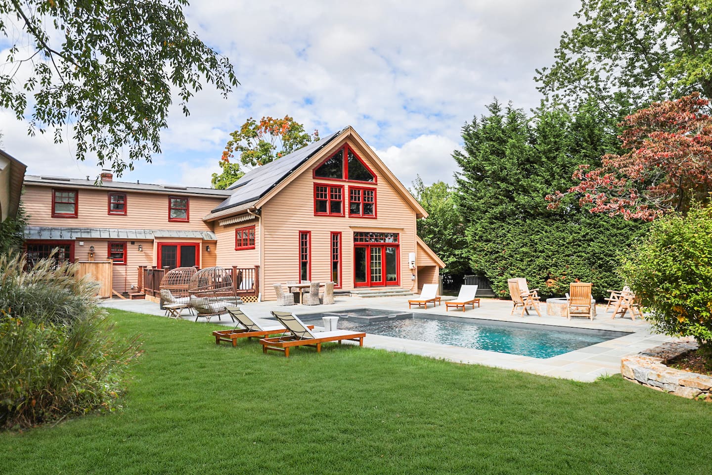 Outdoor area adjoining two homes with room to run around on the grass.