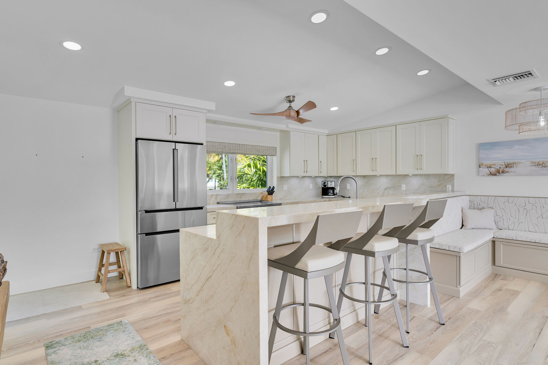 Kitchen with barstools and banquette.
