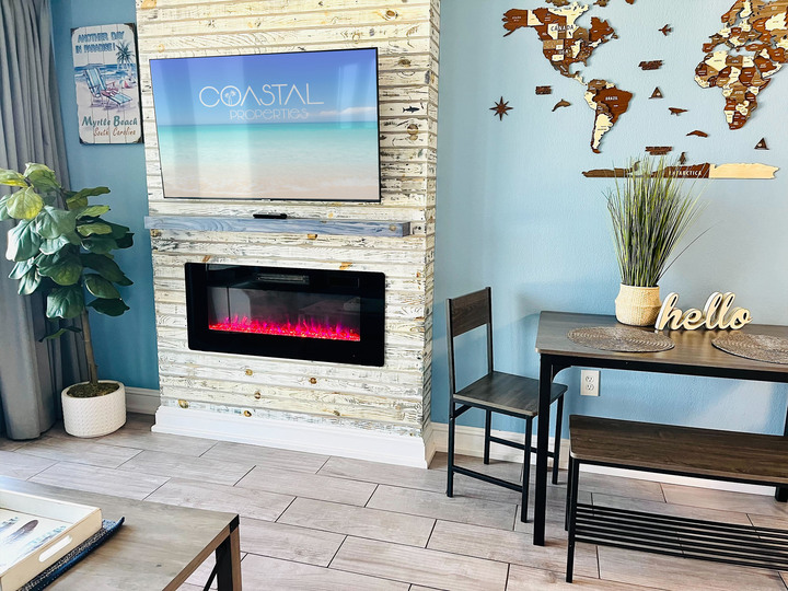 Step into our inviting living room space, where every moment is infused with warmth and relaxation.