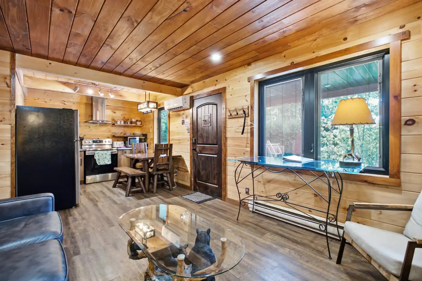 Bright open living and dining area with warm wood finishes