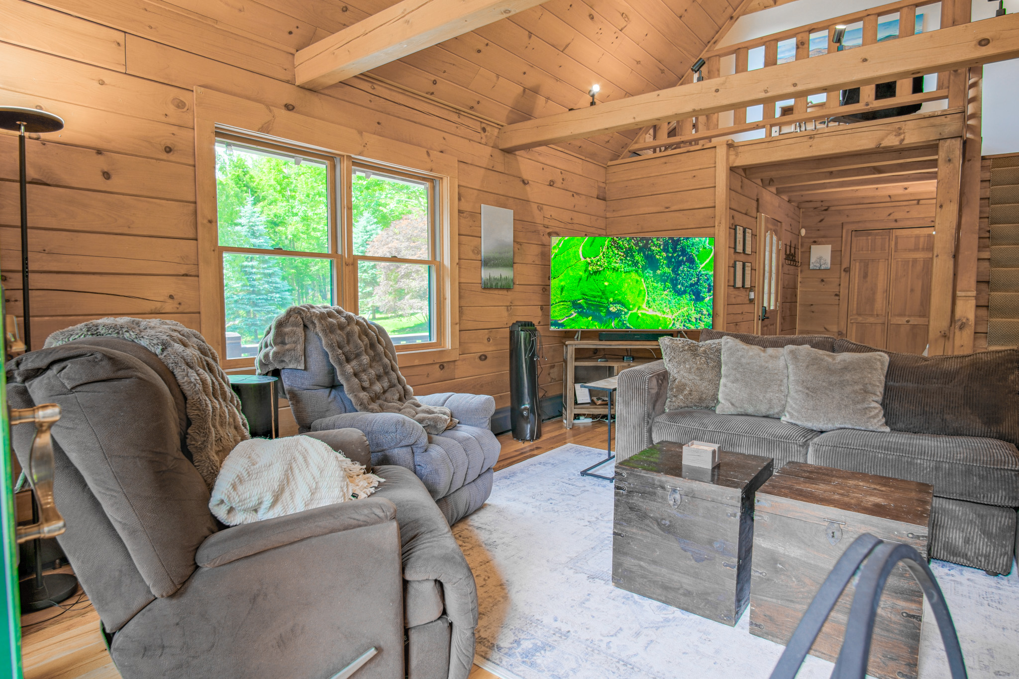 Our 65in TV connected to a Sonos sounds system will offer you the coziest movie nights surrounded by the warmth of log-home chalet interior.