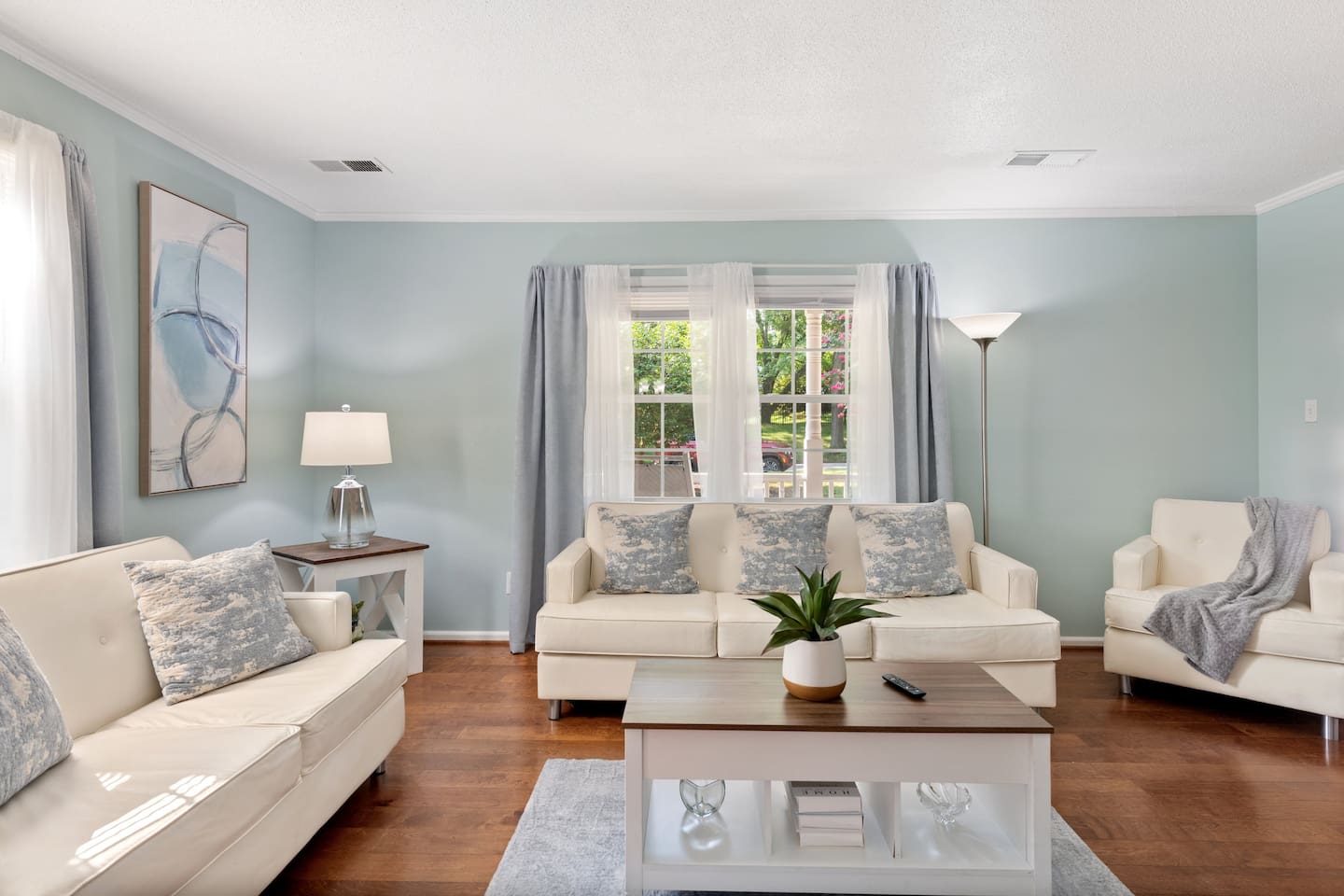 Spacious and sunlit, this cozy living room offers the perfect spot to read, reconnect, or relax in peace.