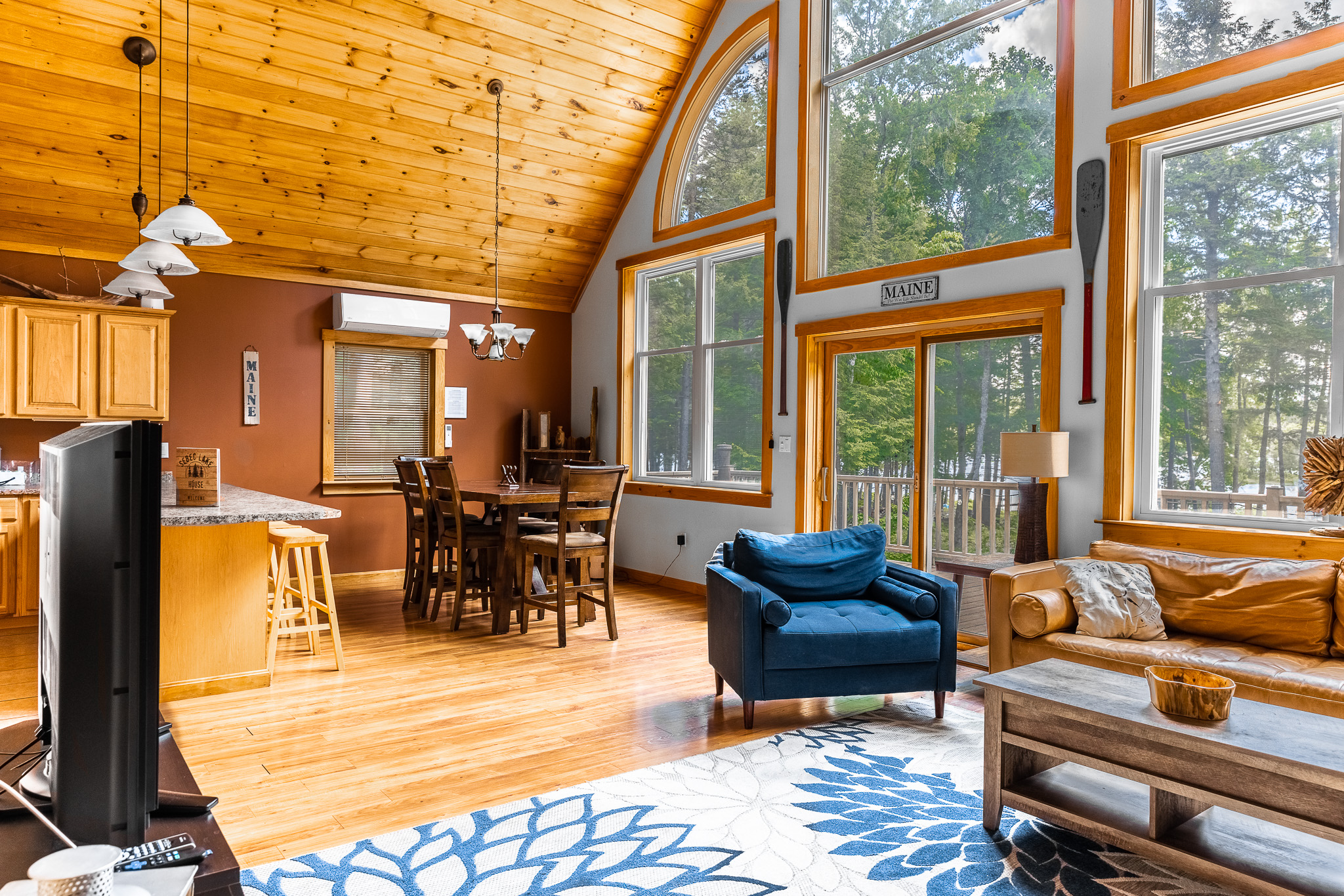 Living room and dining area with huge windows overlooking the lake. Heat pump for heating and cooling.