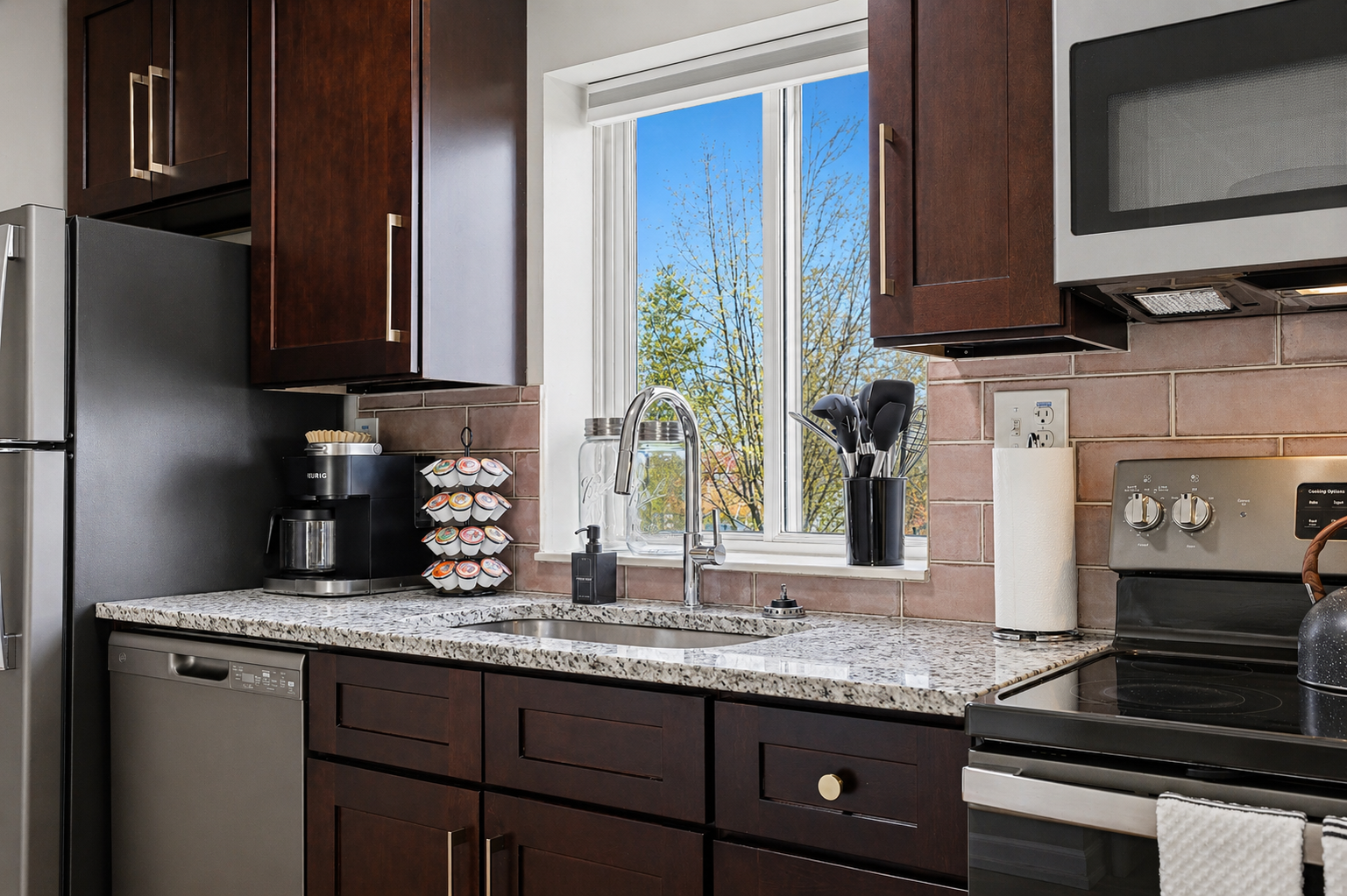 Fully equipped kitchen with a modern stove and oven for your cooking needs.