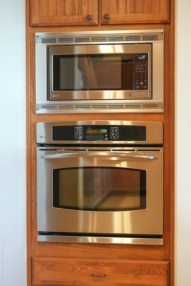 Built-in stainless steel oven and microwave for convenient meal prep.
