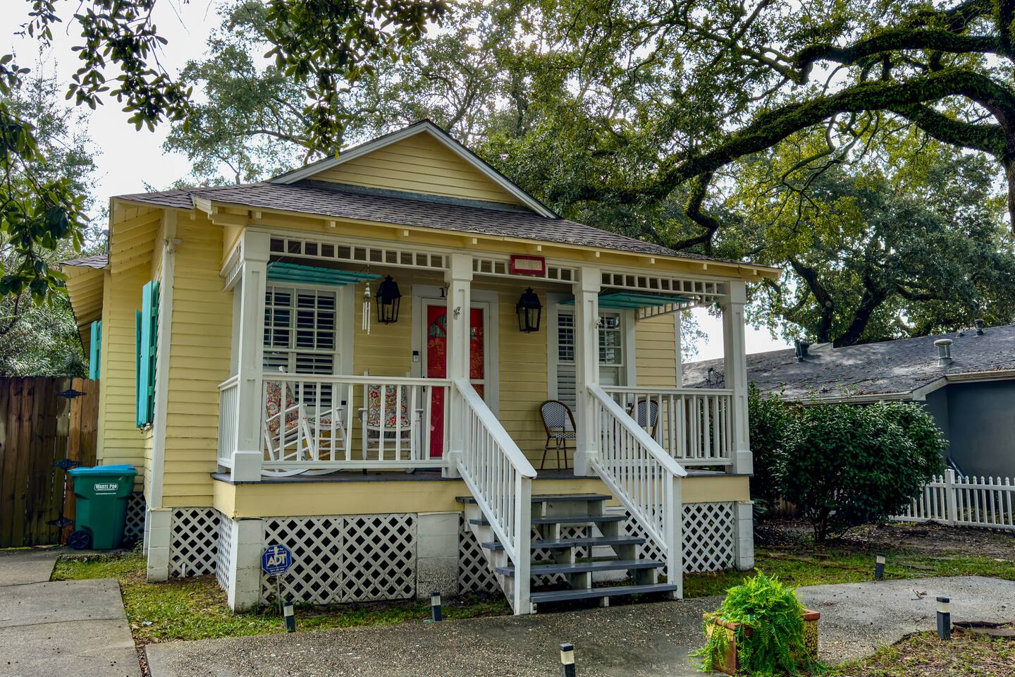 Charming standalone cottage with a front porch, private driveway, and a warm, inviting coastal vibe.