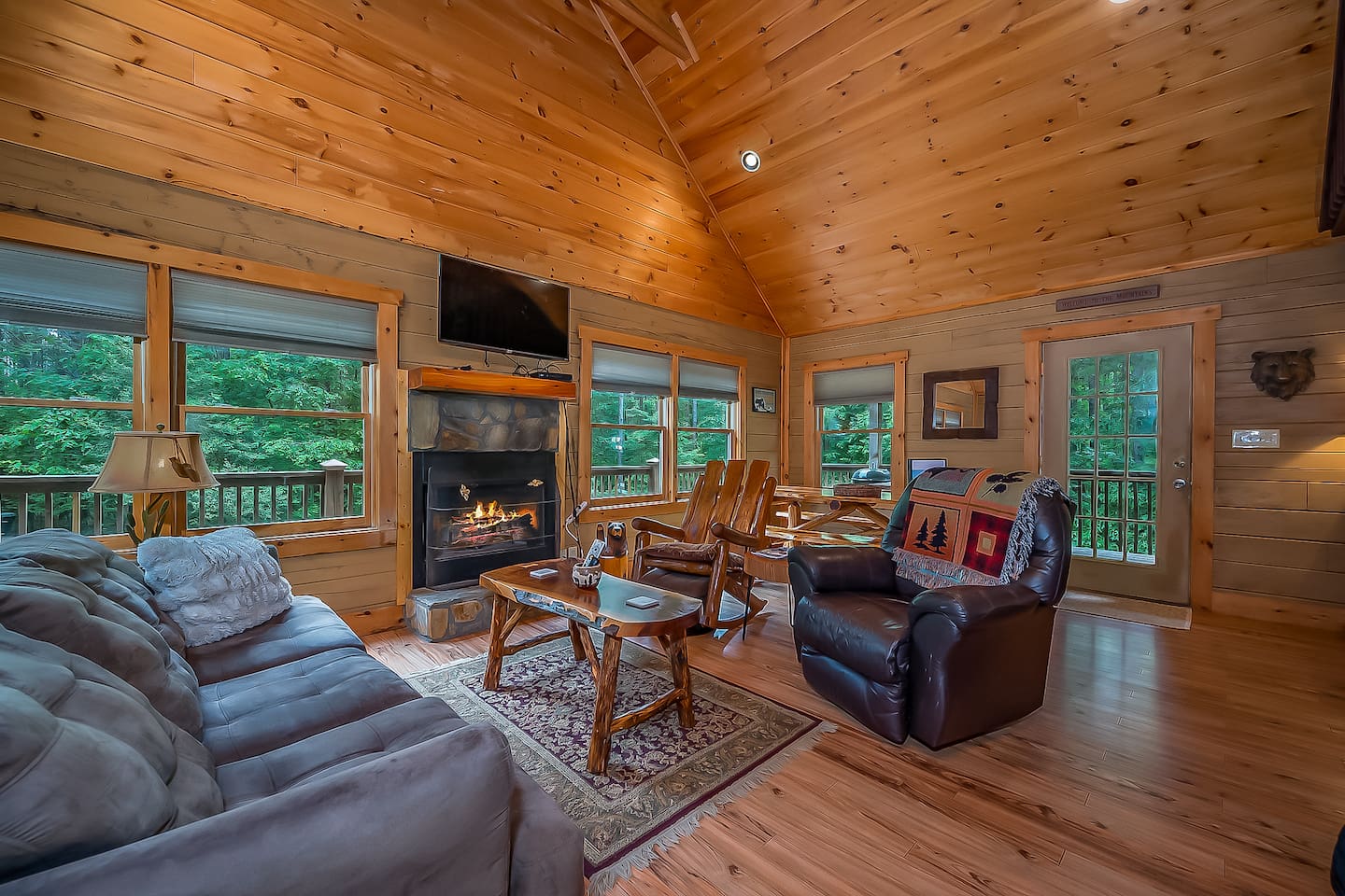 Large open living room with wood burning fireplace