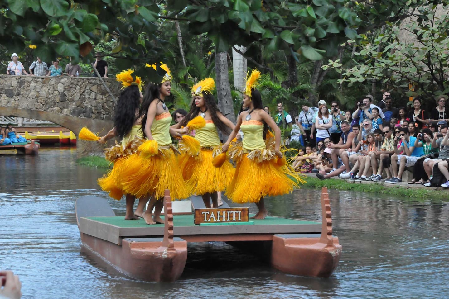 Visitors to the Polynesian Cultural Center (5 mins from the home) watching the parade from the lovely stone bridge in the background