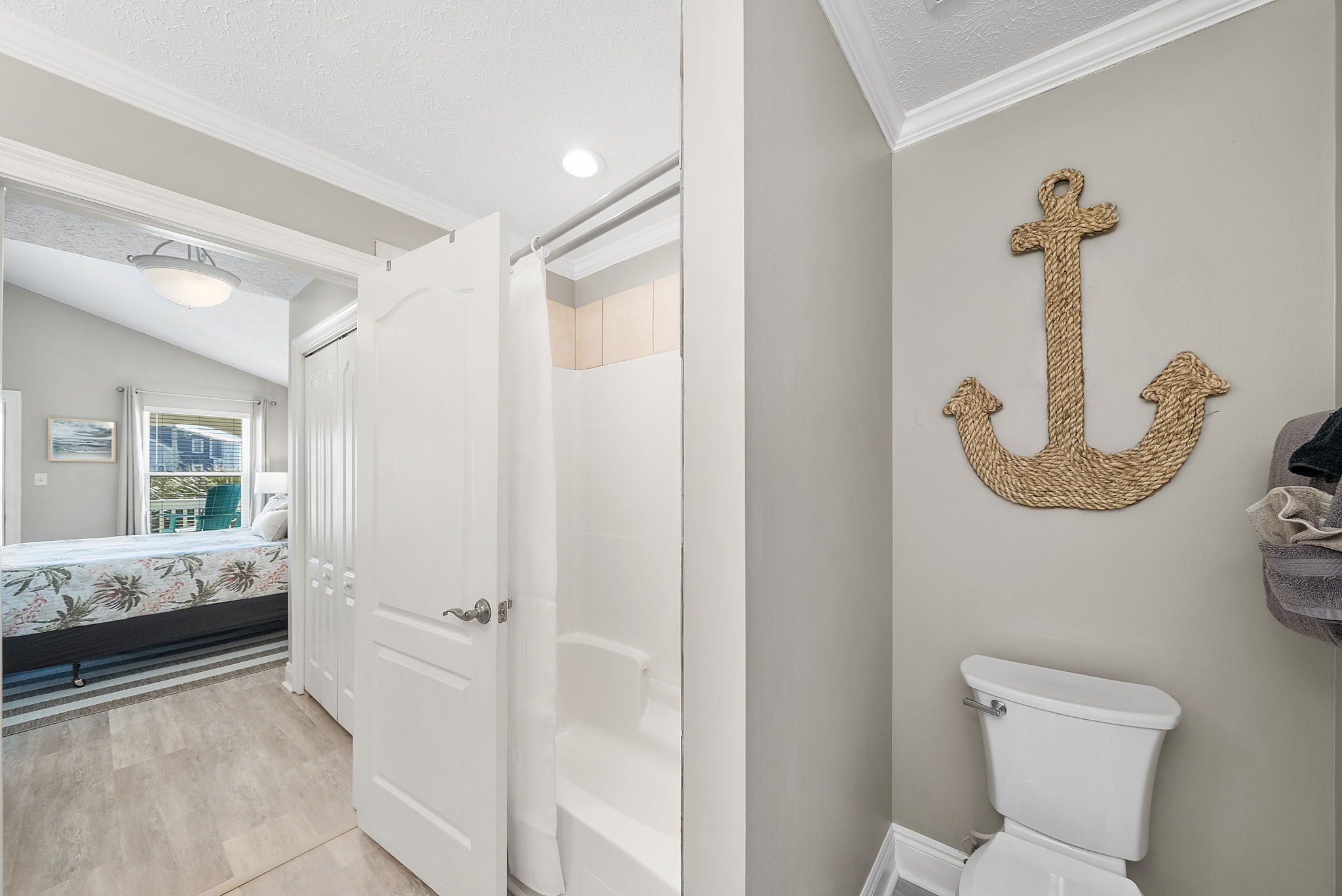 Large bathroom with bath/shower combo. The shower wand also comes off the wall to use to shower kiddos!