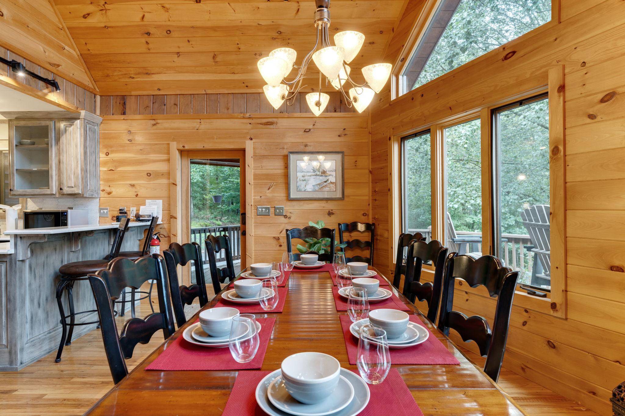 Dining table easily seats 8. High chair also provided.  Chairs provided for 9/10 person.