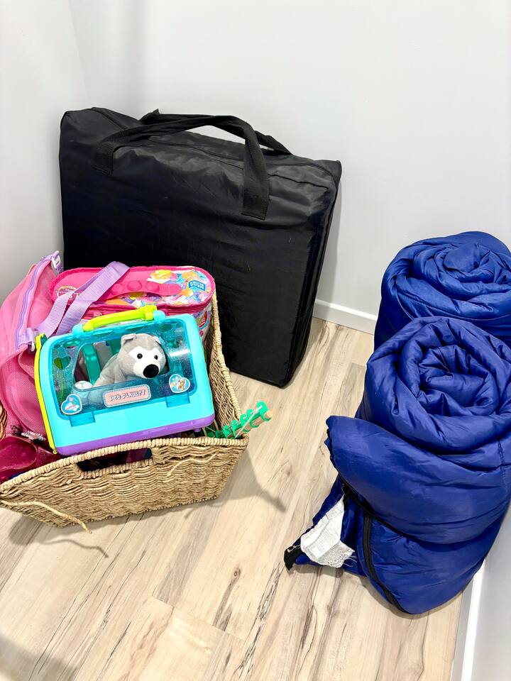Portable crib and kids toys. We also have games and some puzzles to keep those kiddos busy! 