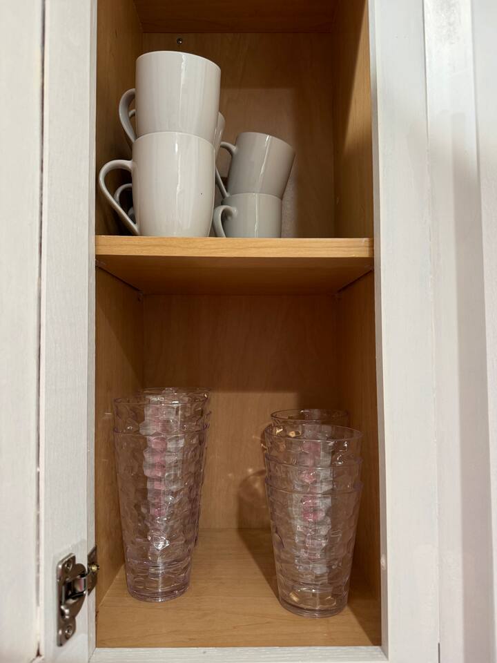 Mugs and tall plastic glasses