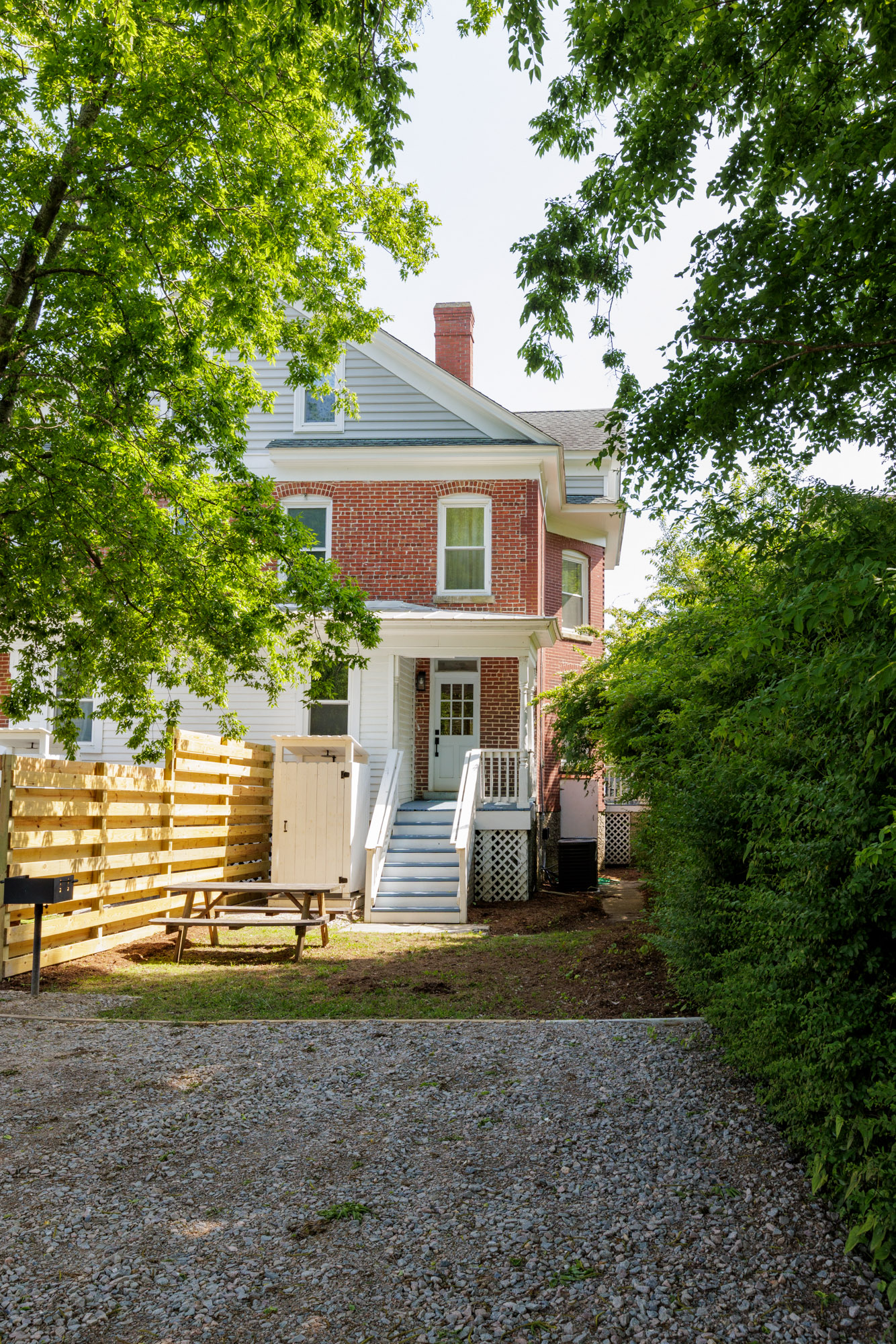 Shared backyard offers additional parking. A BBQ grill and outdoor seating have been recently installed behind the house on each side as well.