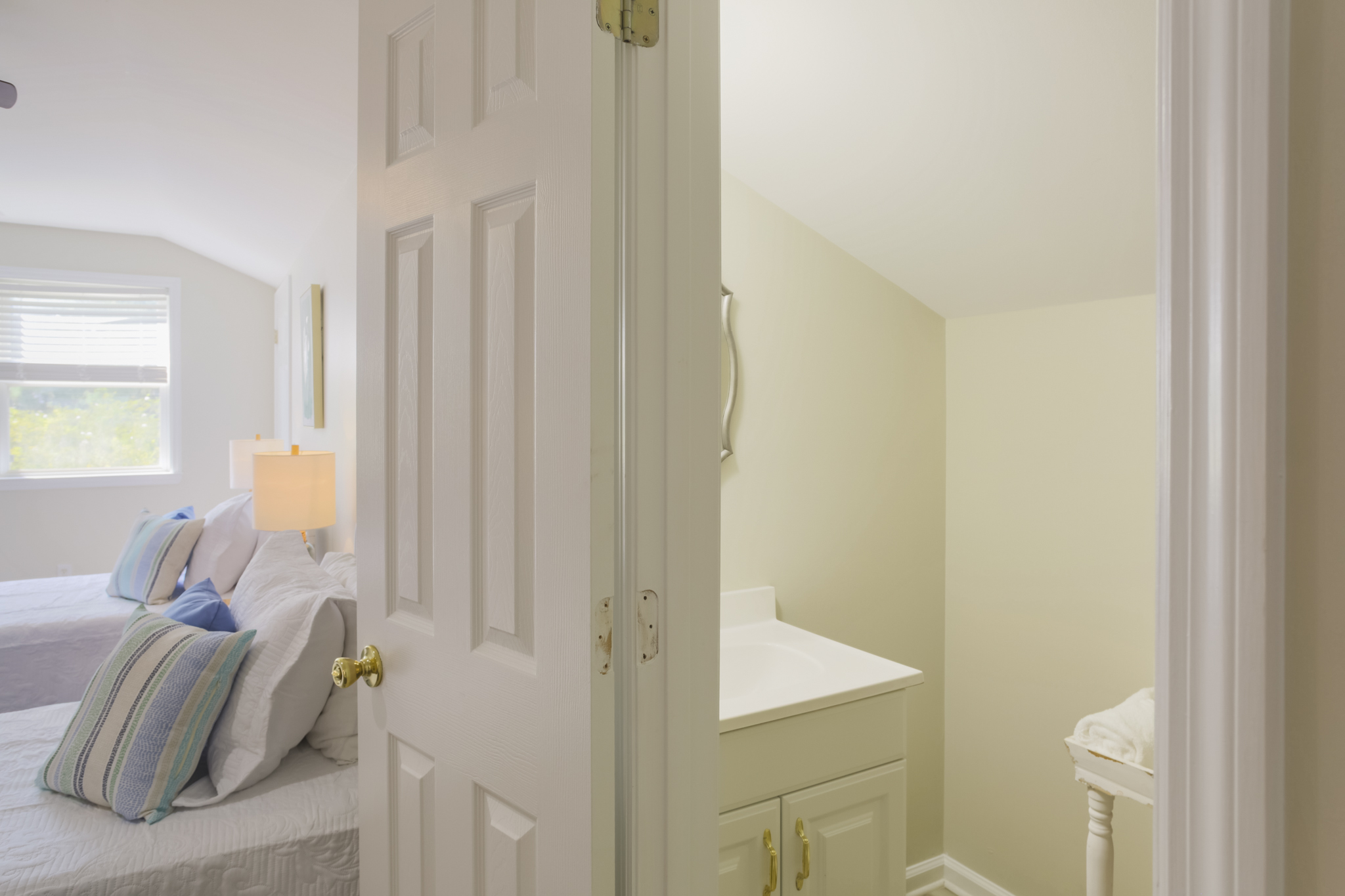 Convenient half bath adds comfort and privacy for loft guests.