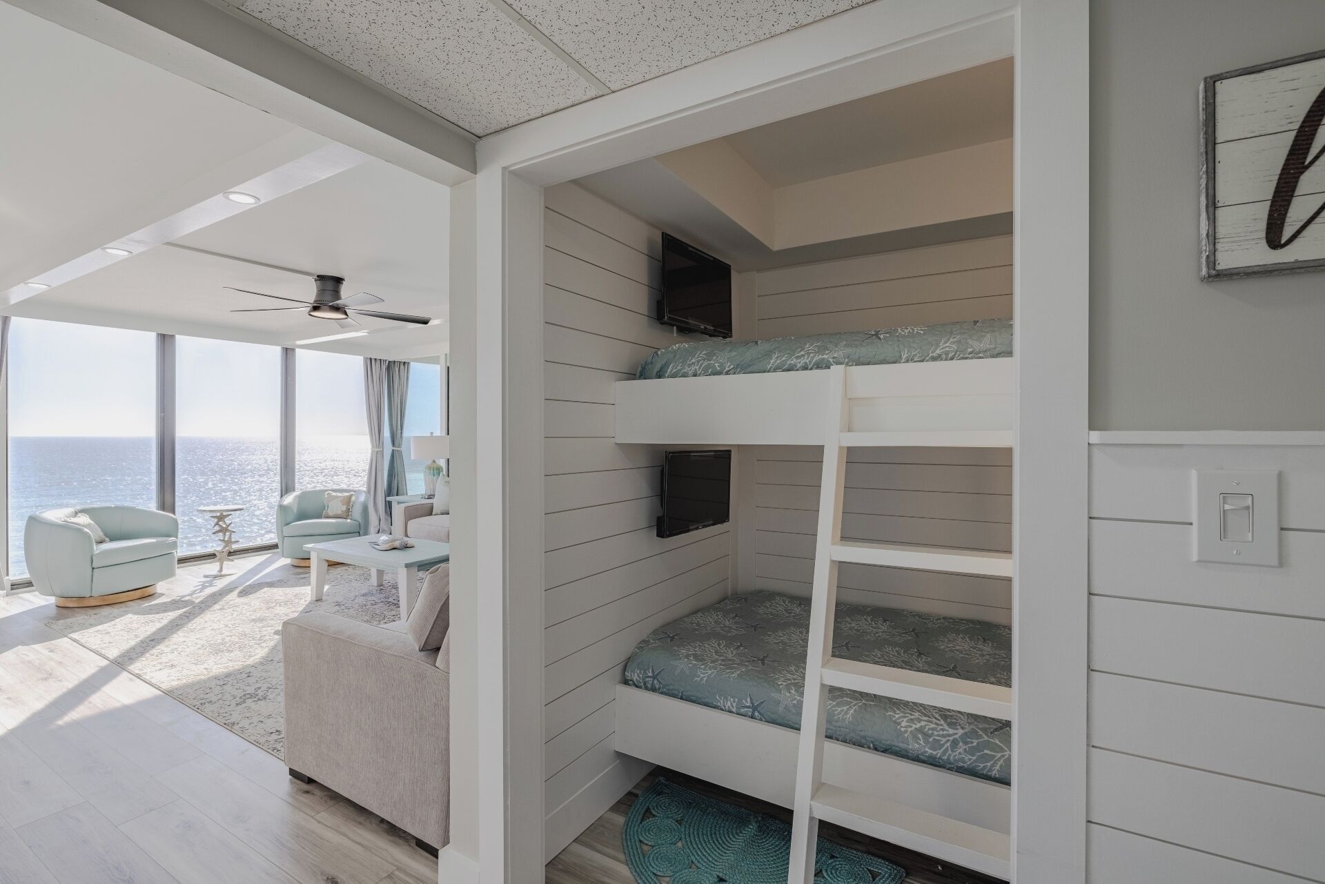 Twin over twin bunk nook with separate TVs