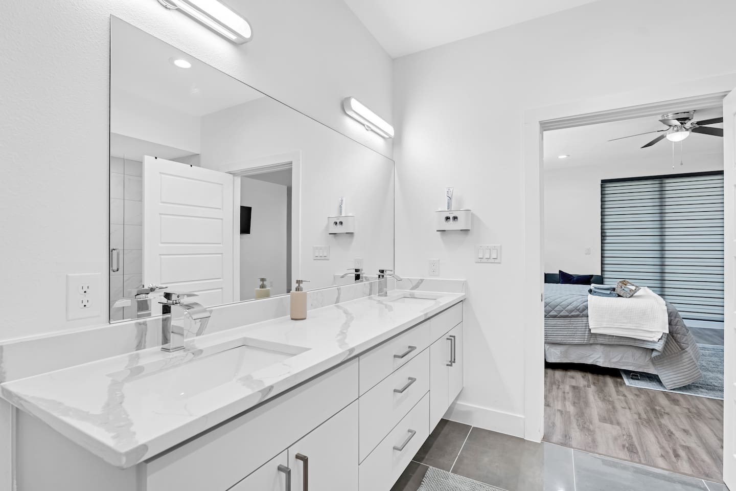 Spa-inspired bathroom with dual vanities and bold modern finishes.