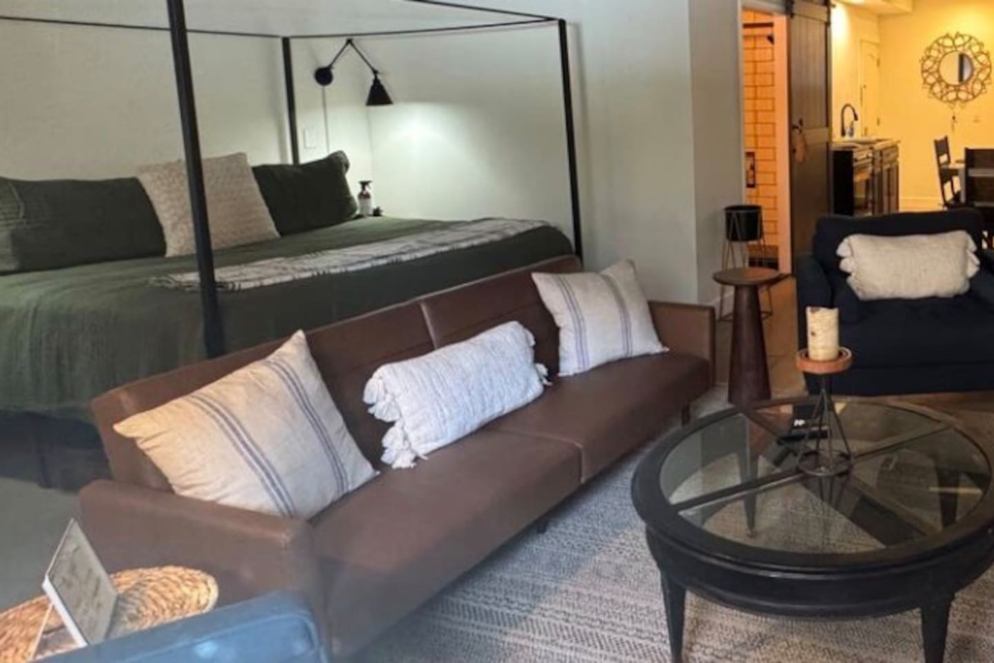 Need additional sleeping space?  Enjoy our leather couch/futon that converts to a single bed.  Memory foam topper available for additional comfort. 