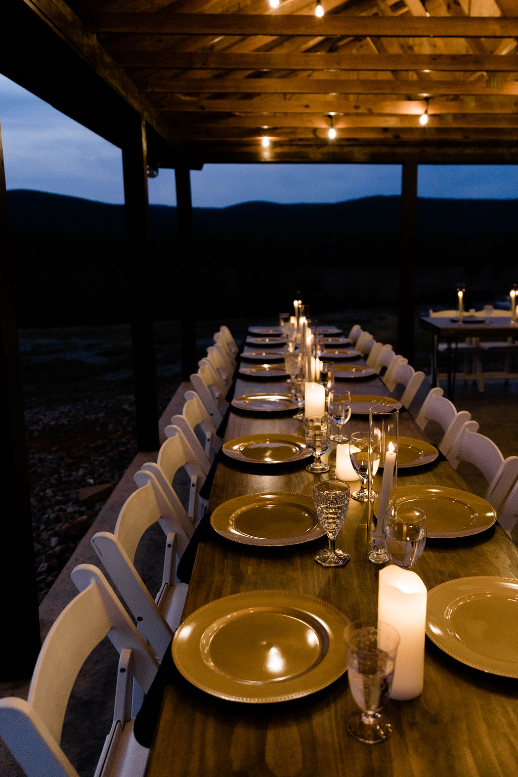 Evening reception setup under the covered patio lights.