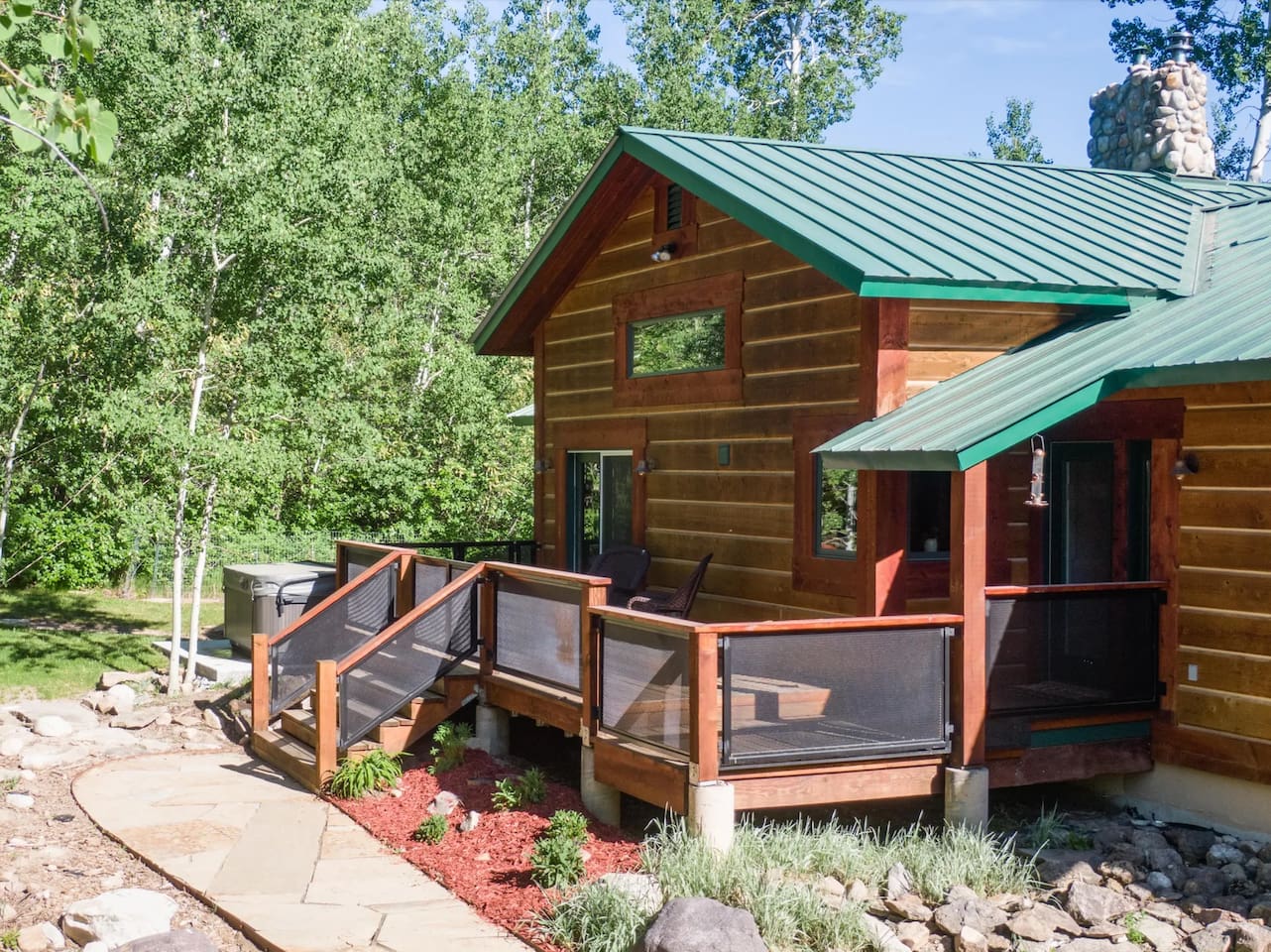 Large, private hot tub adjacent to front deck with easy access from the main floor.