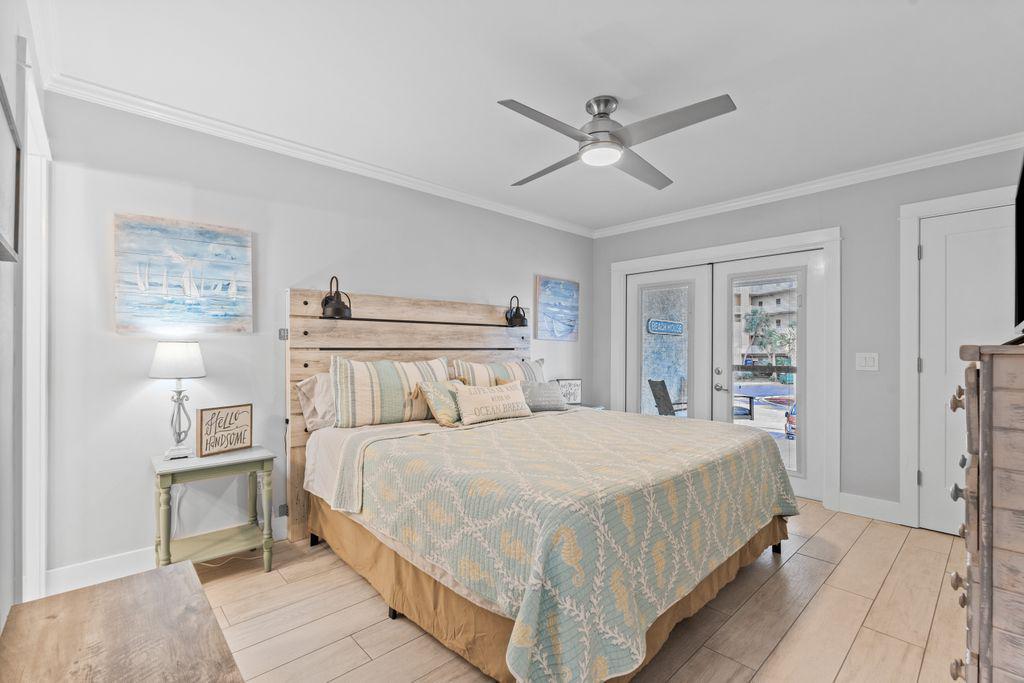 Main bedroom with king bed, ceiling fan
