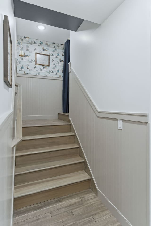 Bright stairway with modern finishes leading to a cozy and inviting upper level