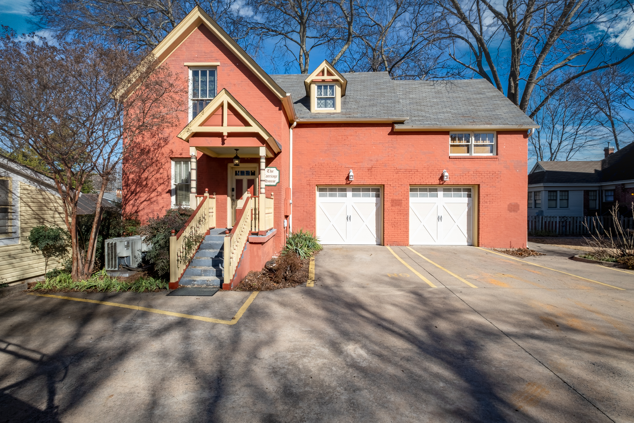 Exterior view of the historic Carriage House, home to the Garden Spa Suite.