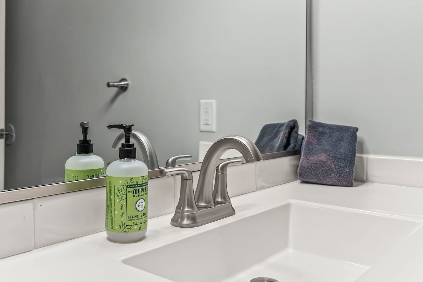 Bright and functional bathroom layout with modern flooring, neutral tones, and ample open space.