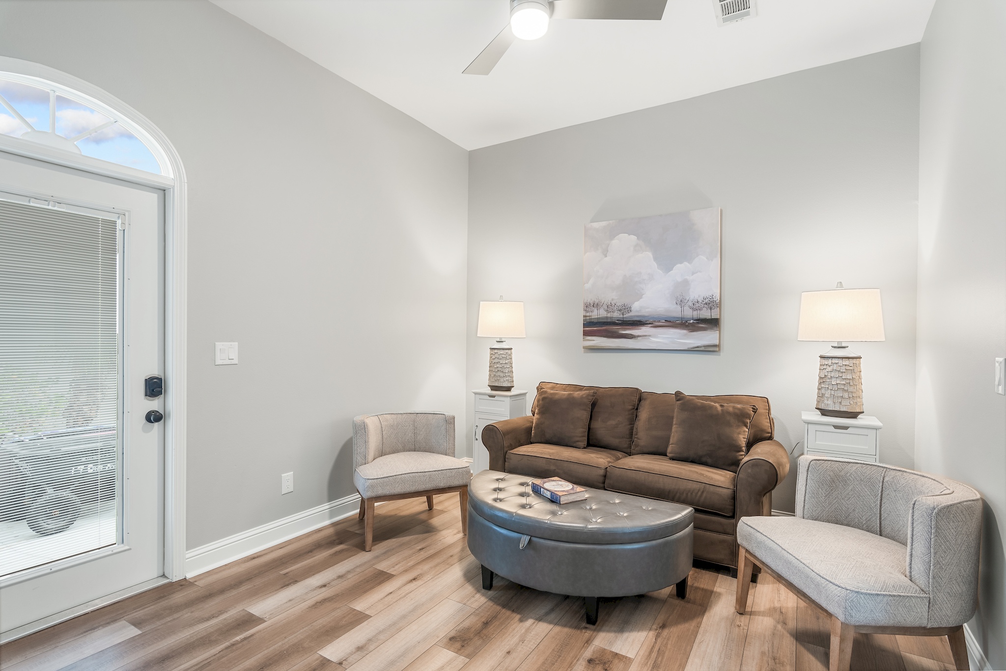 Guest suite living area with comfortable seating and Smart TV