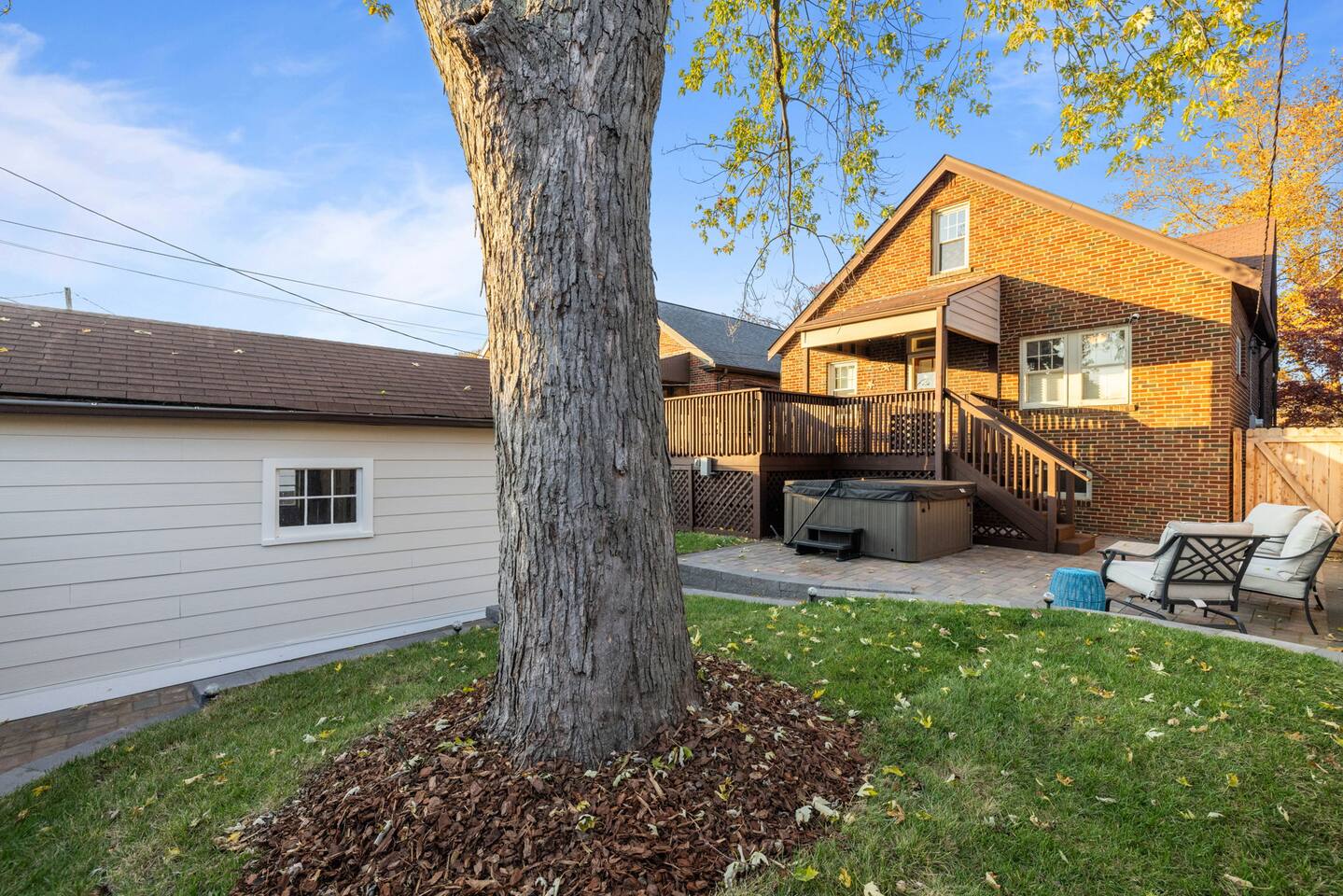 Fenced in back yard includes patio area with Jacuzzi and comfy outdoor seating. Two extra folding chairs available.  Separate towels provided for hot tub use.