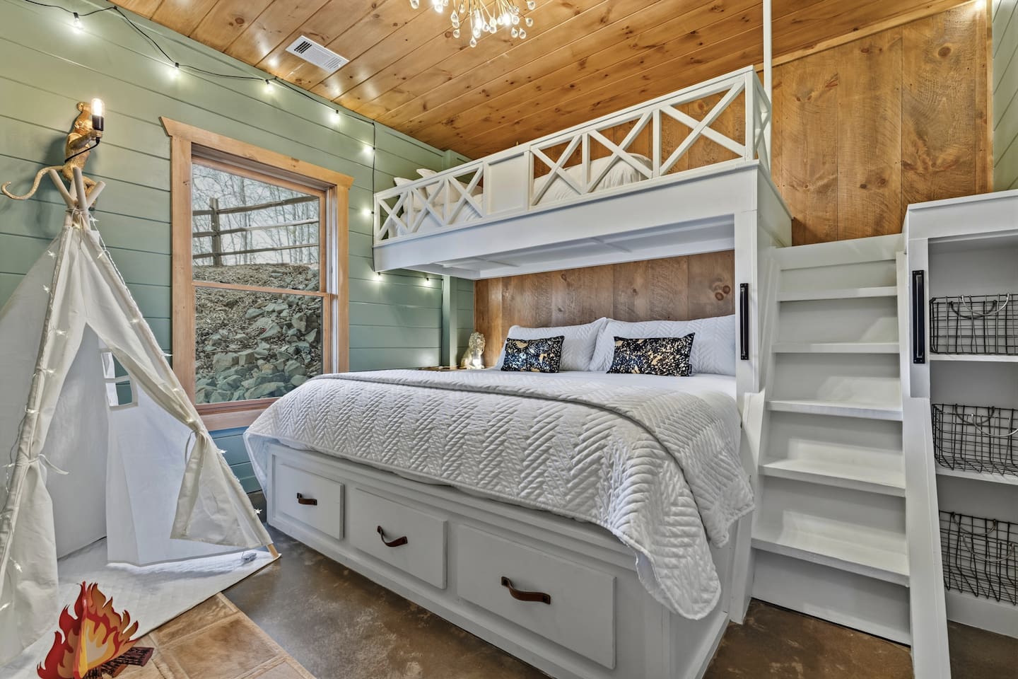 Kids (and adults!) will love this magical fantasy bedroom featuring a comfy king below and twin XL loft above. Complete with a cozy play tent, twinkling string lights, fun chandelier, built-in charging outlets in the nook, and plenty of storage.