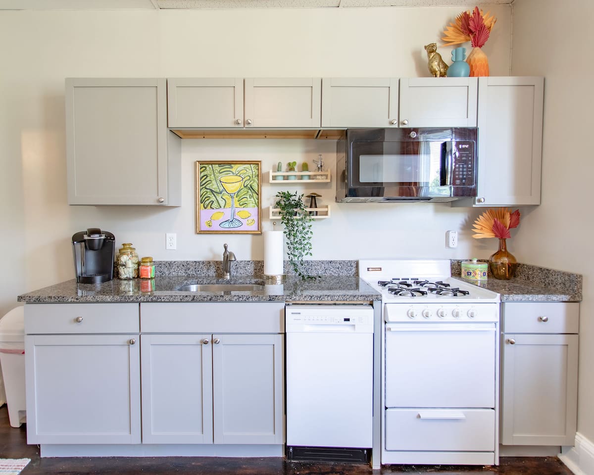 Fully equipped kitchen with modern appliances, including a stove, oven, refrigerator, microwave, and all the cookware and utensils you need to prepare and enjoy your meals.