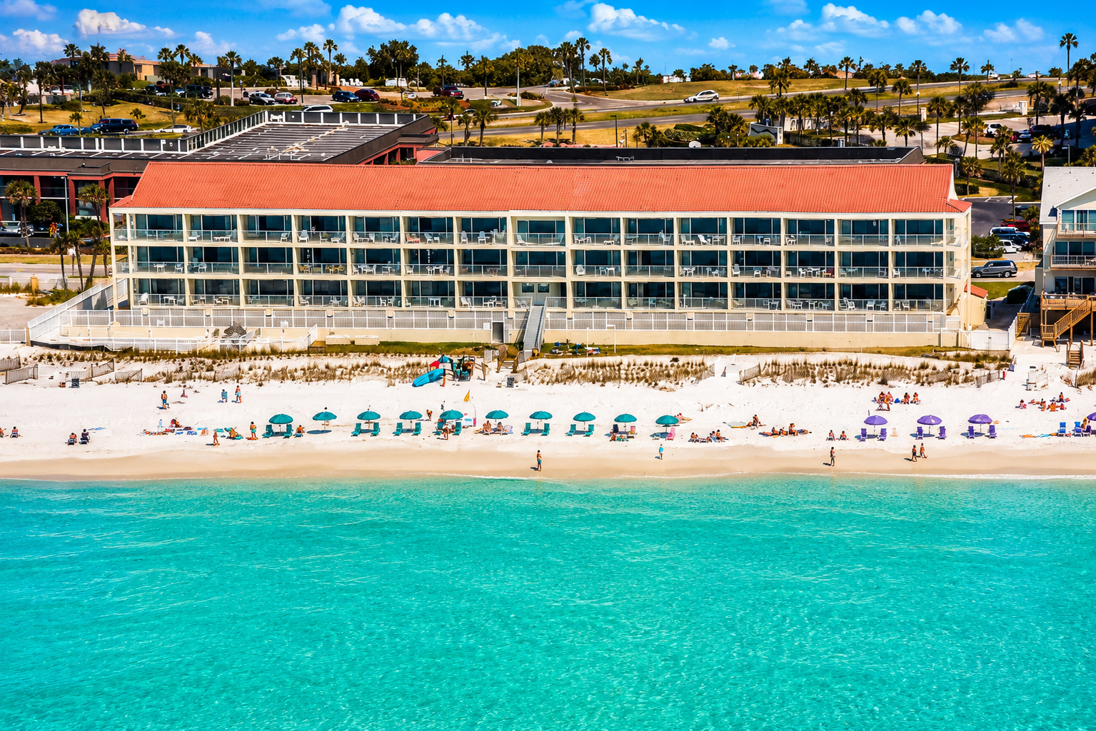 Beachfront view of the Seafarer building, directly on Destin’s white-sand shore.