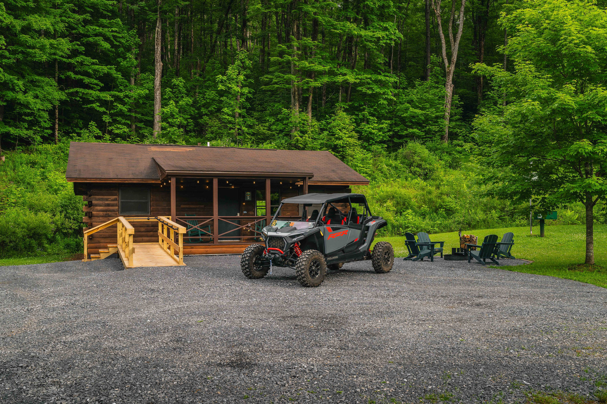 🛻 Trail-riding HQ — UTV-friendly with trail access steps from the door. *(Riding is seasonal: Memorial Day Weekend through end of September. UTV shown not included; rentals from Denton Go.)*