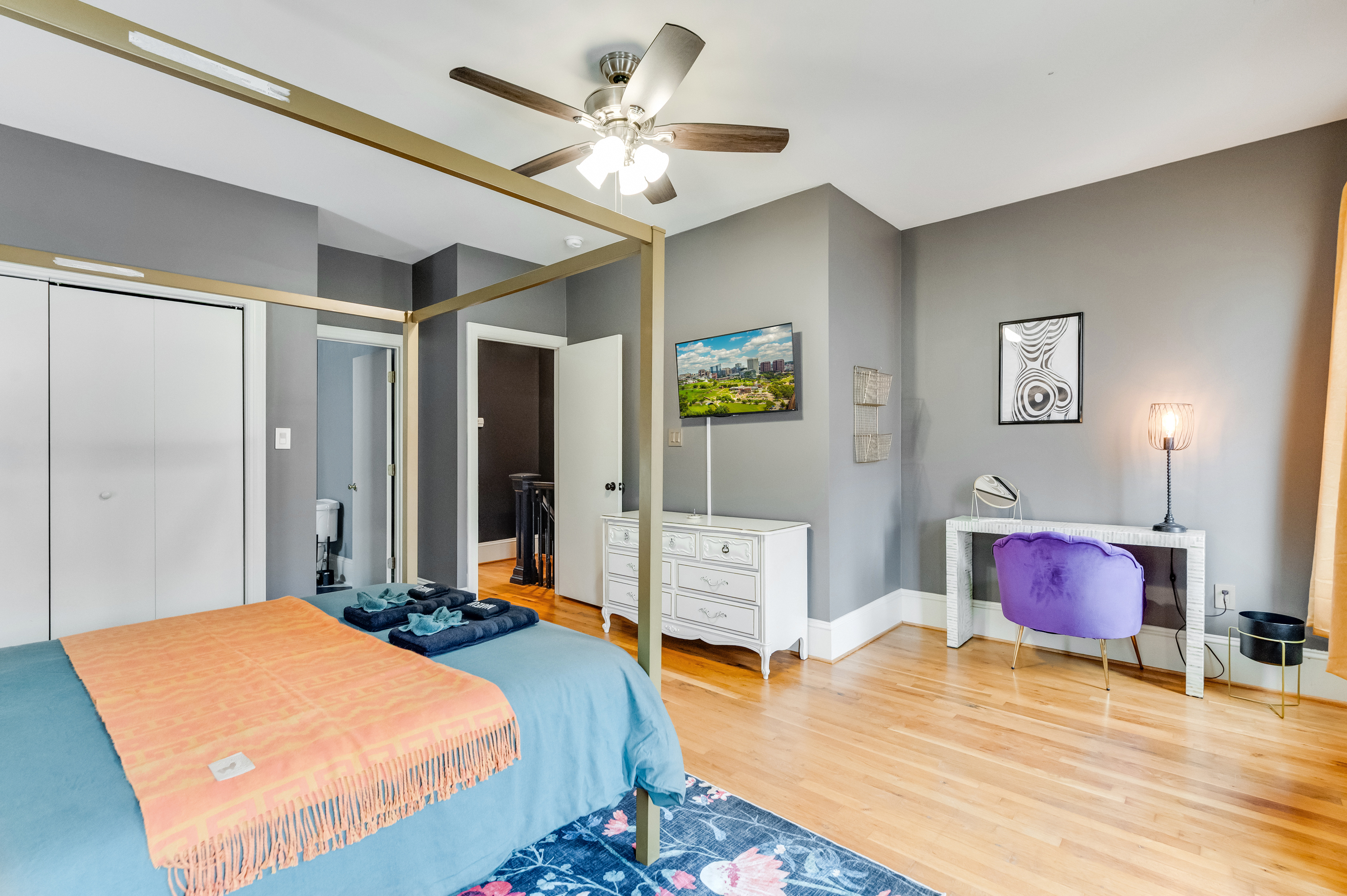 Queen Bedroom 2: Modern decor meets vibrant colors for a stylish stay in Richmond!