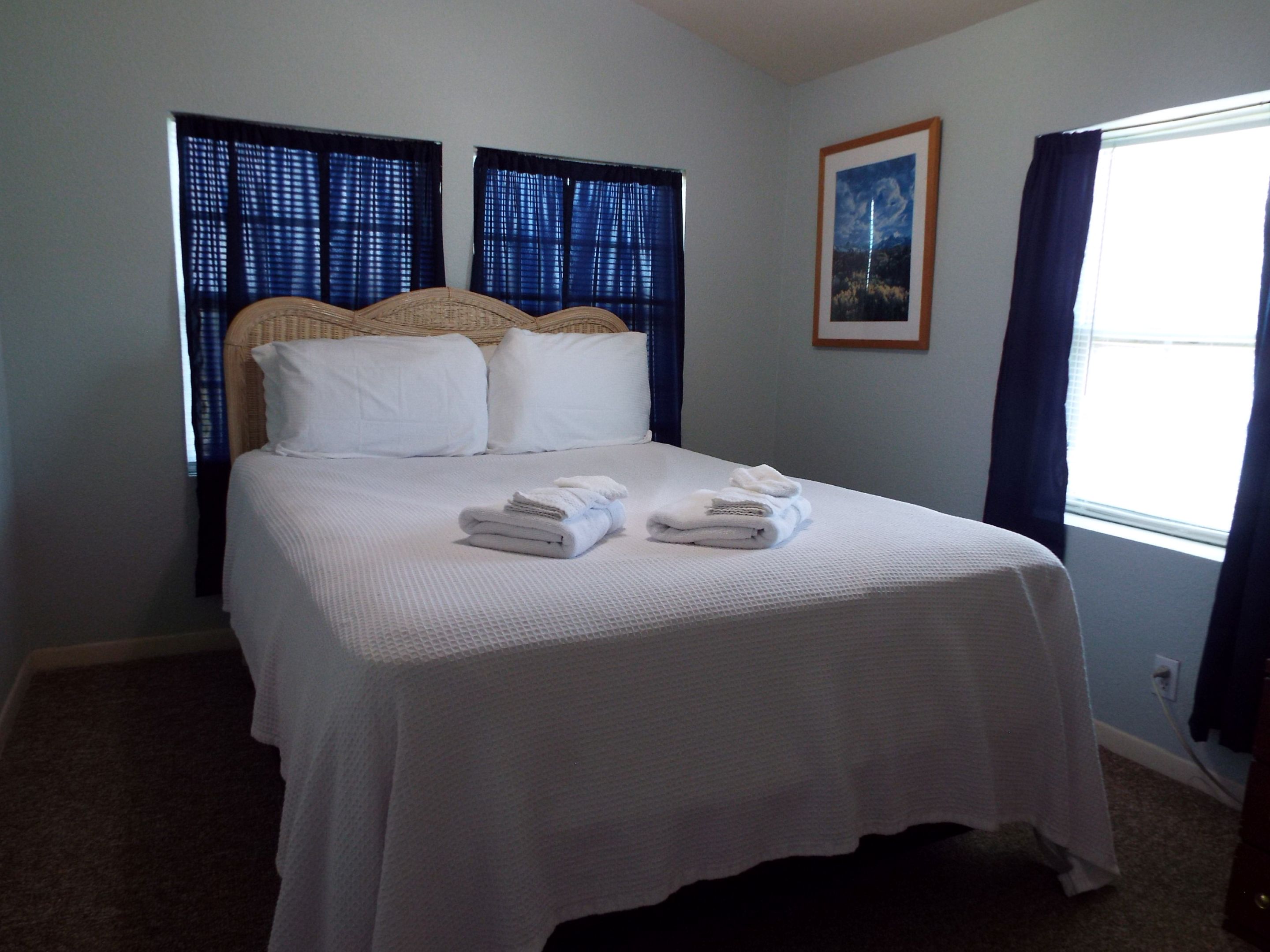 Cool and comfy guest bedroom with queen