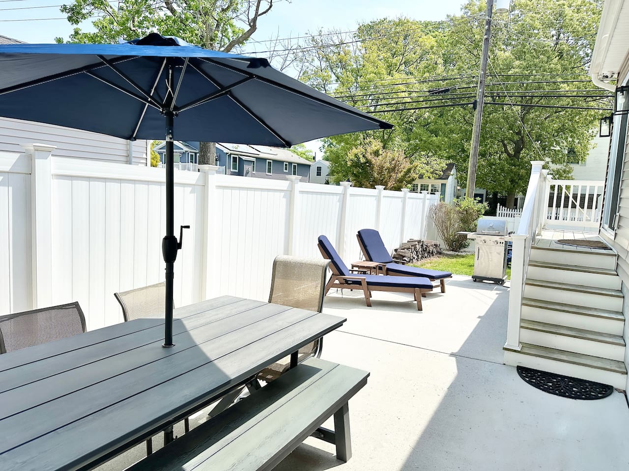 Fire up the grill for a summer BBQ on this private, fenced-in patio. Whether dining under the shaded umbrella or lounging in the sun, this outdoor space is built for slow afternoons and fresh air.
