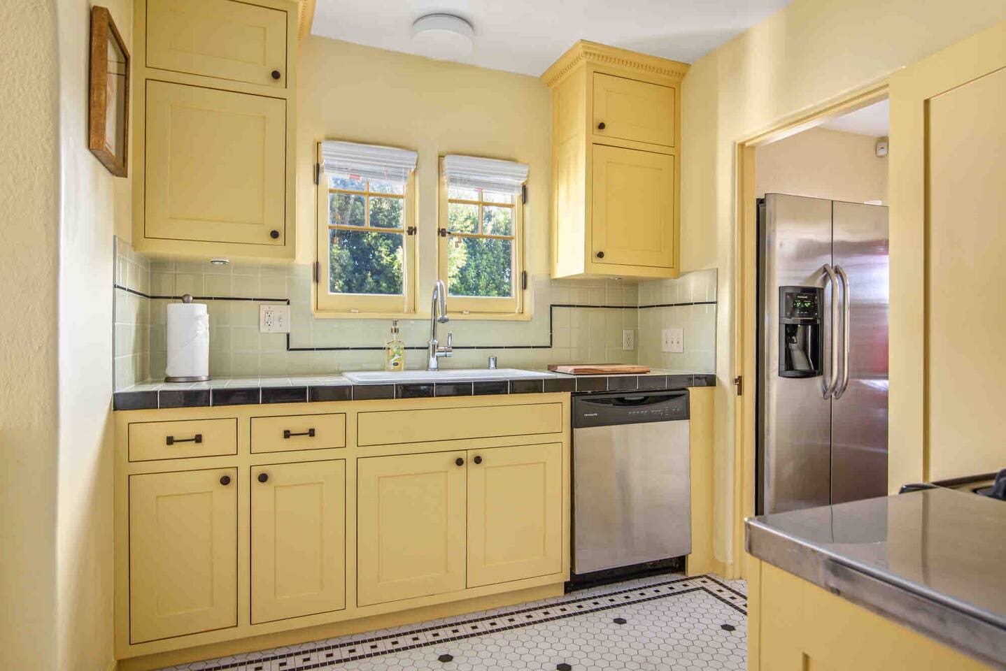 Windows, a large kitchen sink and plenty of countertop space makes this the perfect spot to prepare your meals at home. 