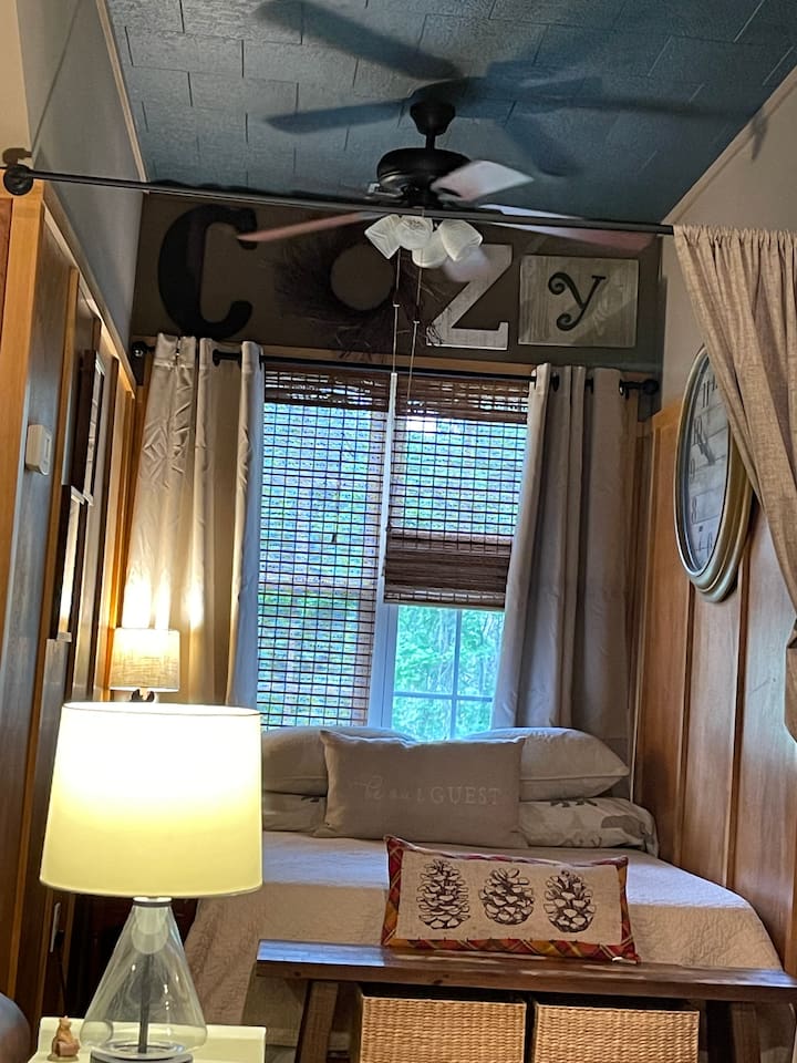 Sleep well in our comfy bedroom alcove complete with memory foam full bed, blackout curtains, and ceiling fan!