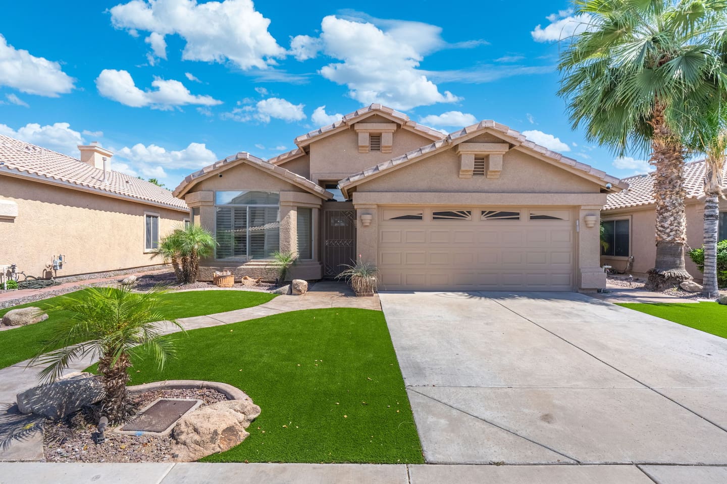 A spacious two-car garage, wide driveway, and well-kept front yard make arriving and settling in a breeze — everything is thoughtfully maintained from the street to the backyard.