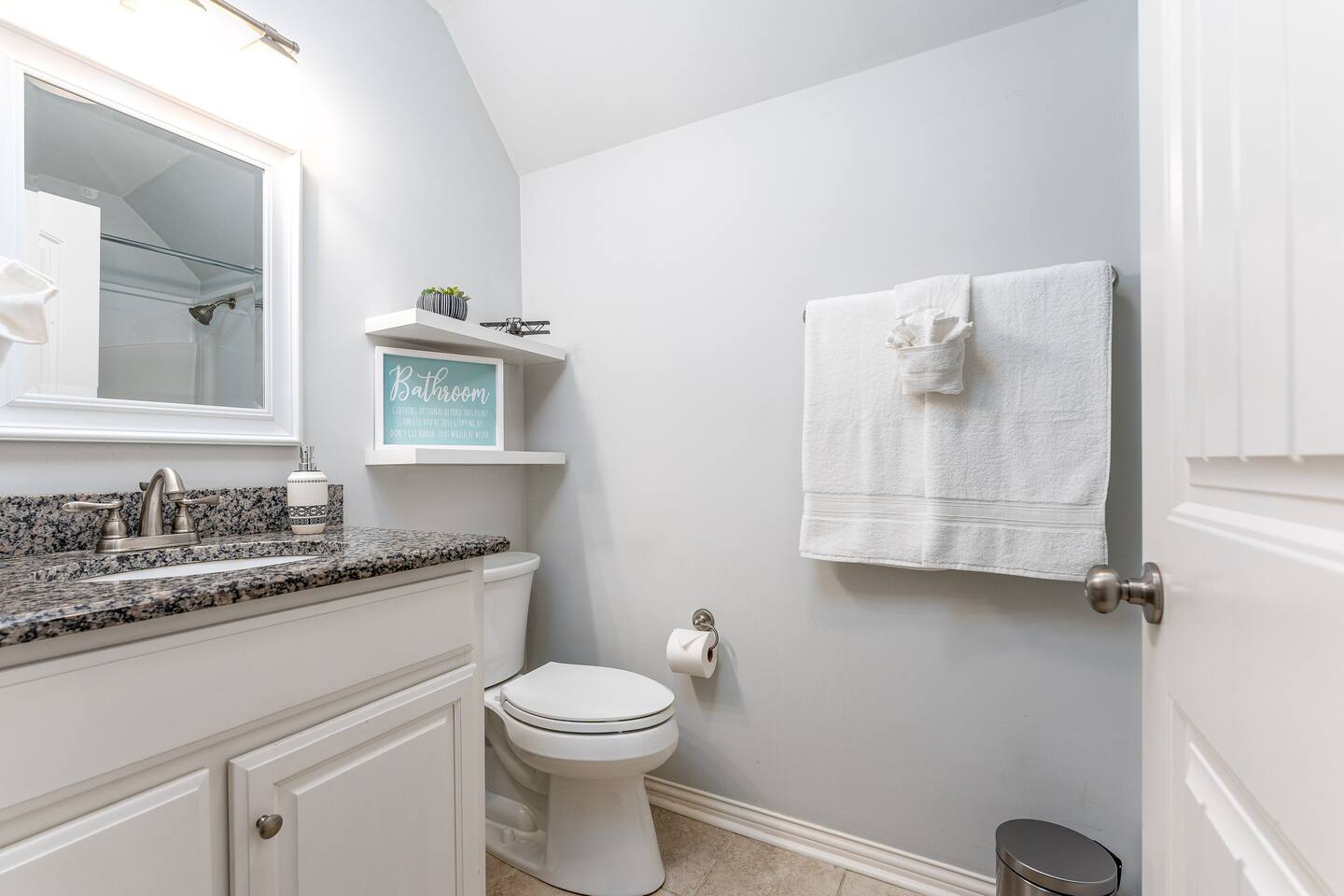Bathroom with granite countertops and tub/shower