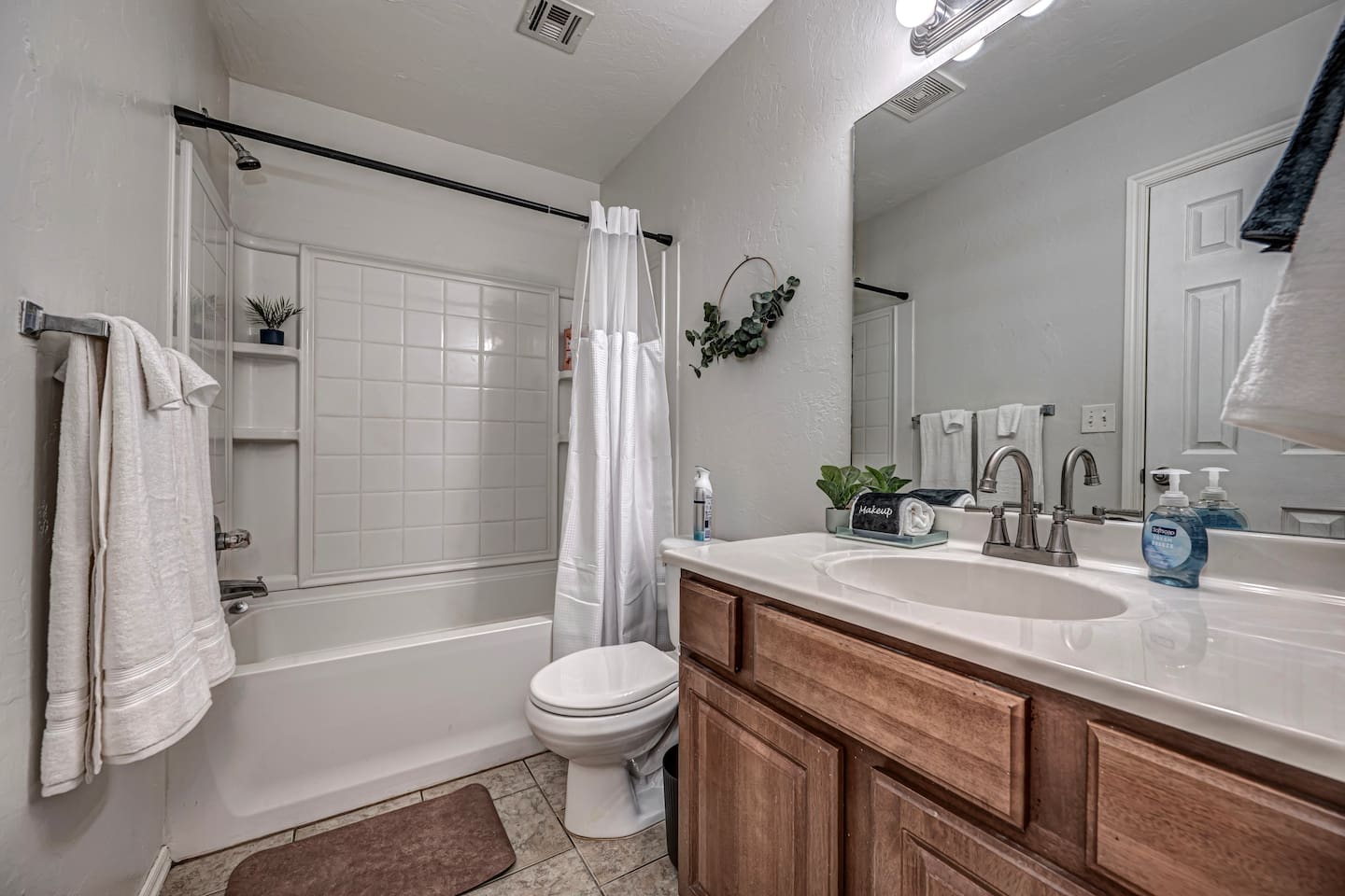 Modern bathroom with shower–tub combo, perfect for families.