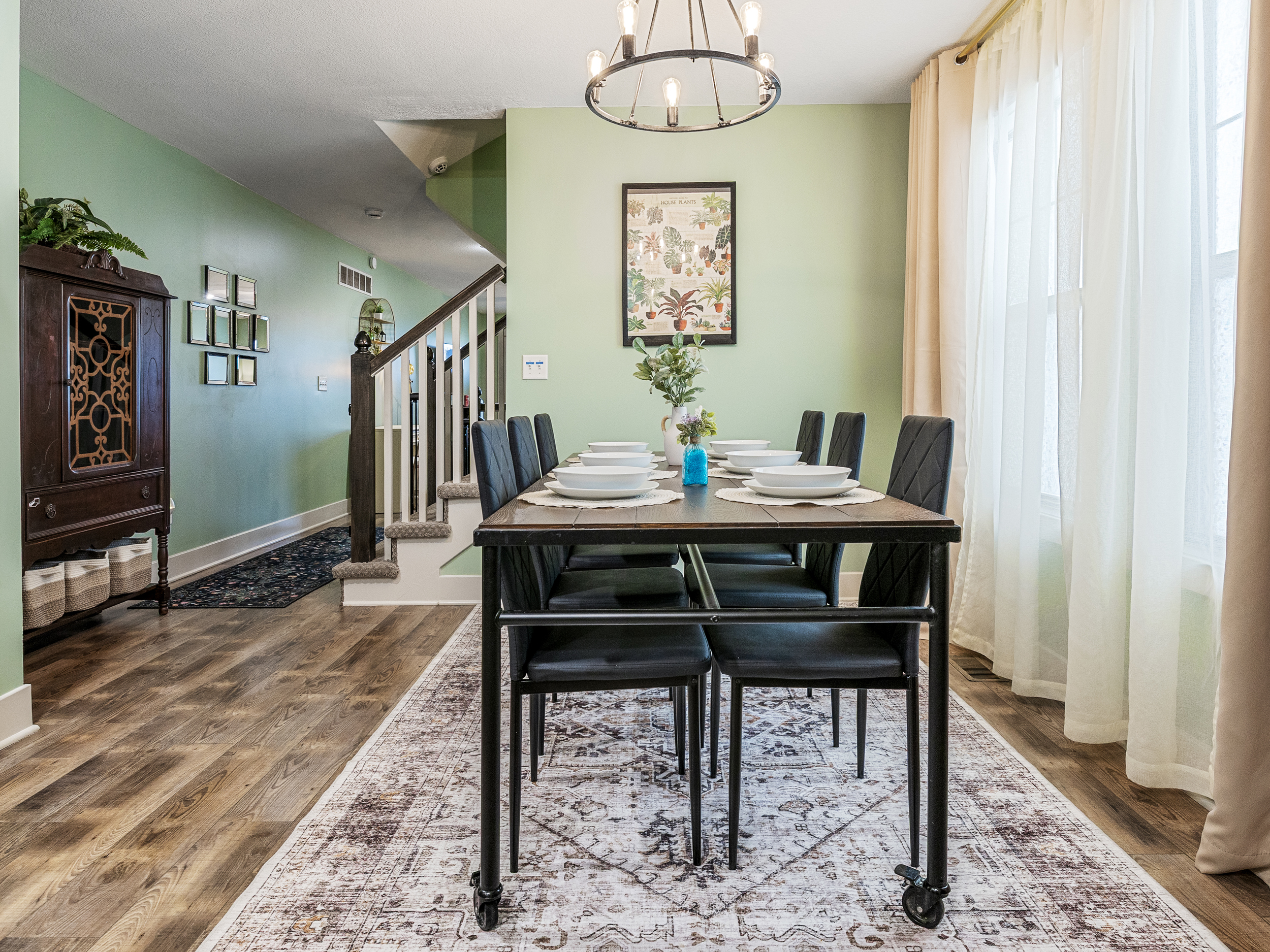 Casual dining area creates a welcoming place to share meals and connect with family or friends. Large windows help fill the space with natural light.