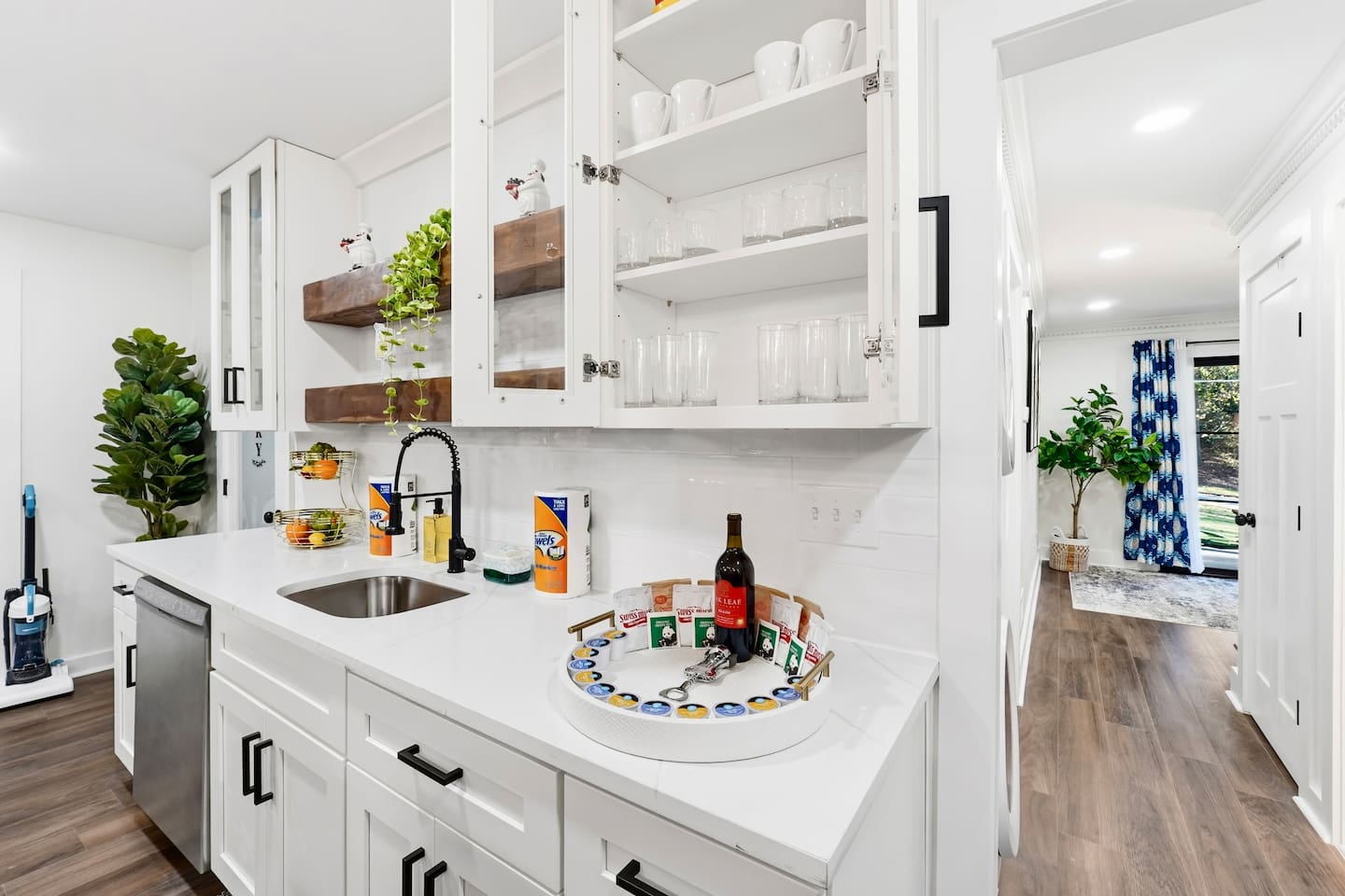 Beautiful white kitchen fully equipped with all the appliances and essentials of a home away from home.